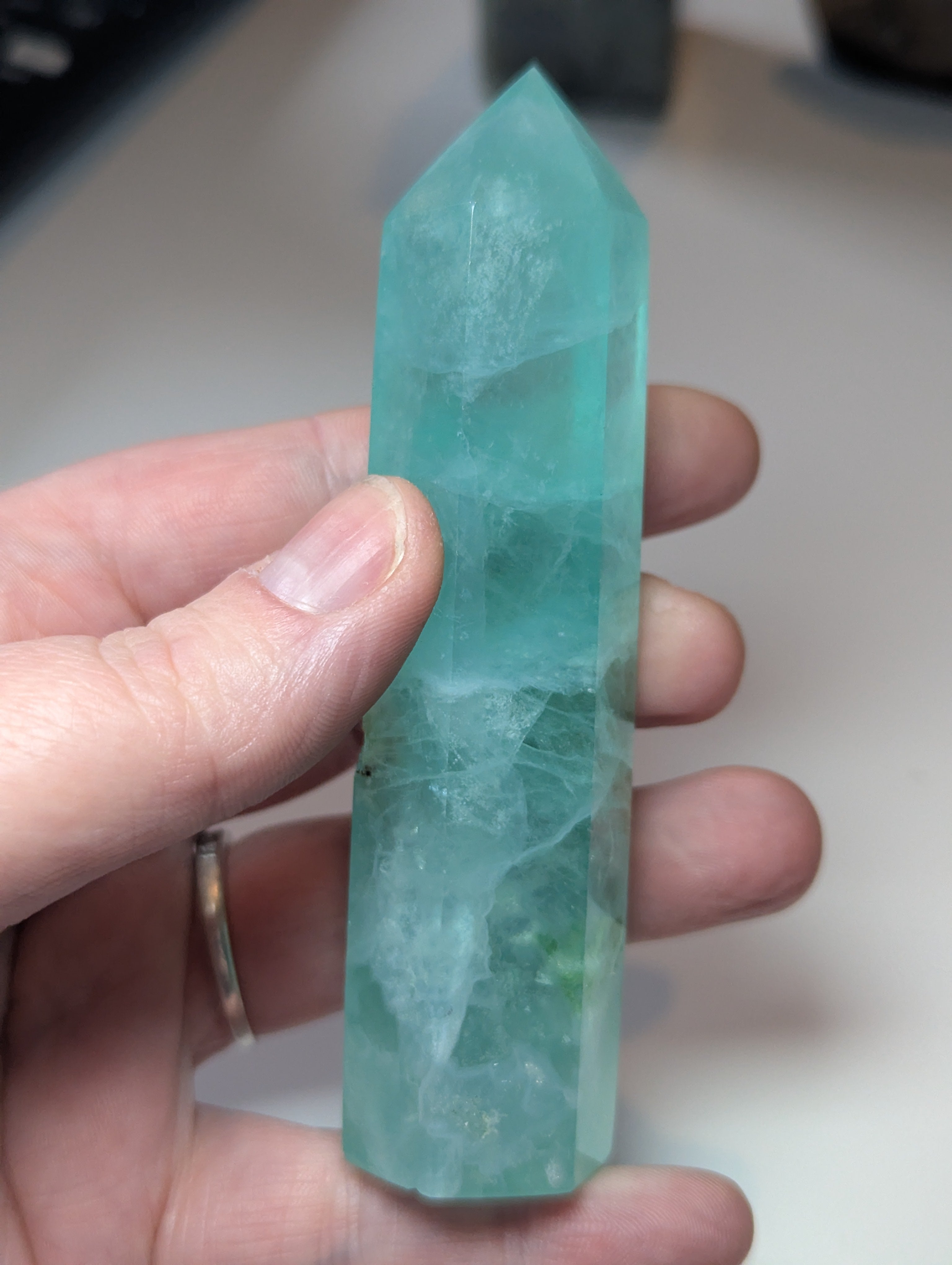 Green flouite crystal tower with imperfections