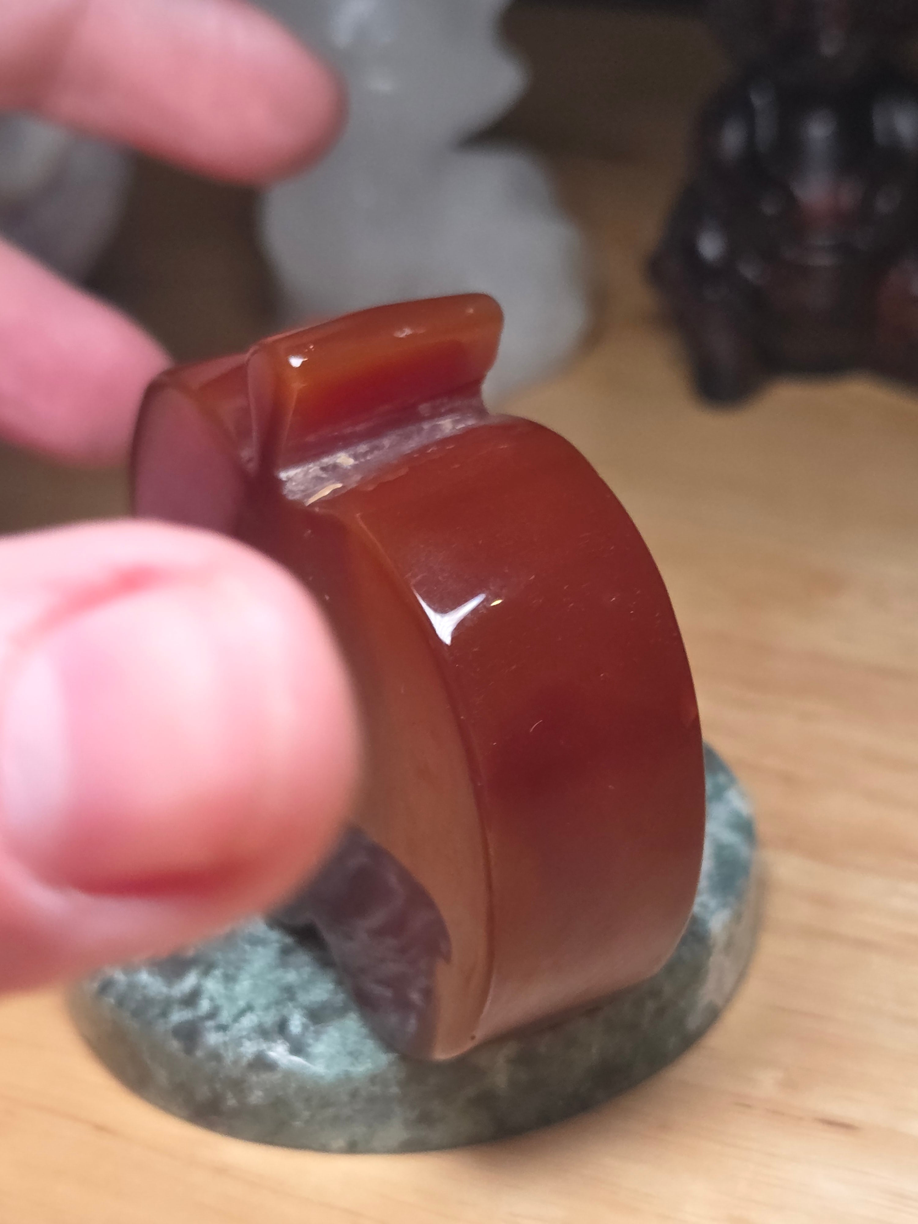 Carnelian crystal apple with imperfections