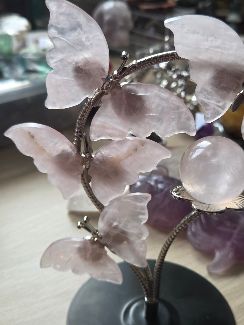 Rose quartz crystal sphere and  butterfly stand