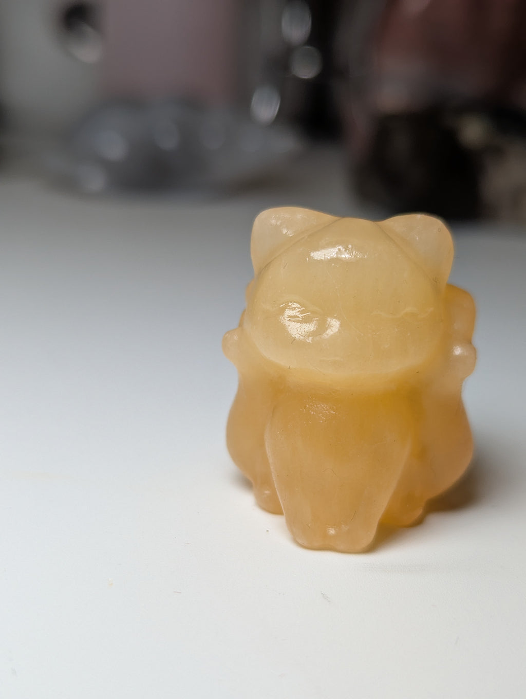 Orange calcite crystal nail tail fox