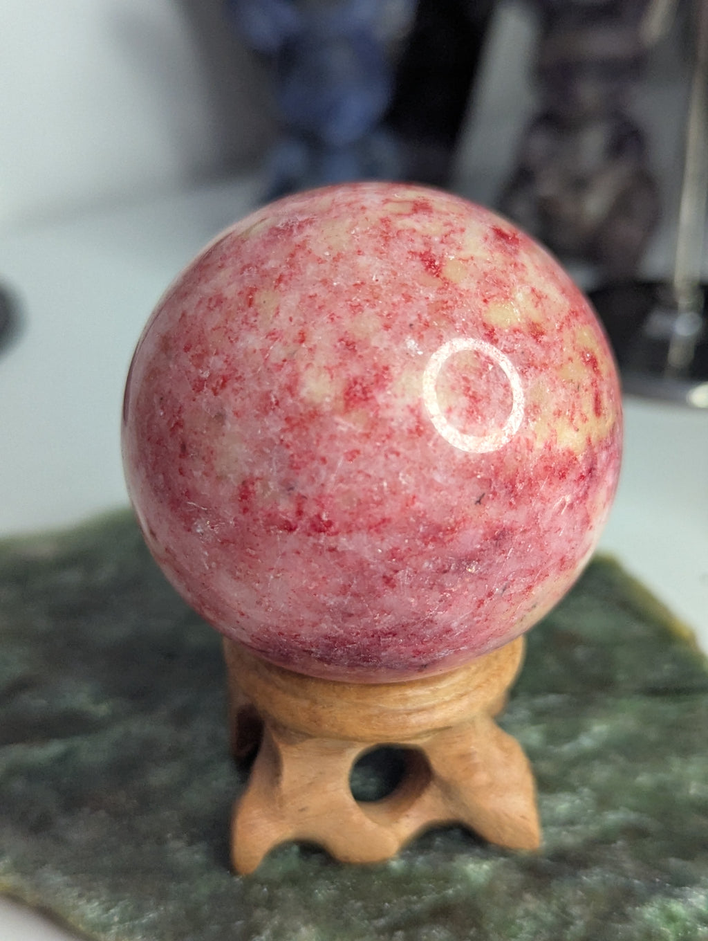 Pink Zoiltie crystal sphere with Orange UV