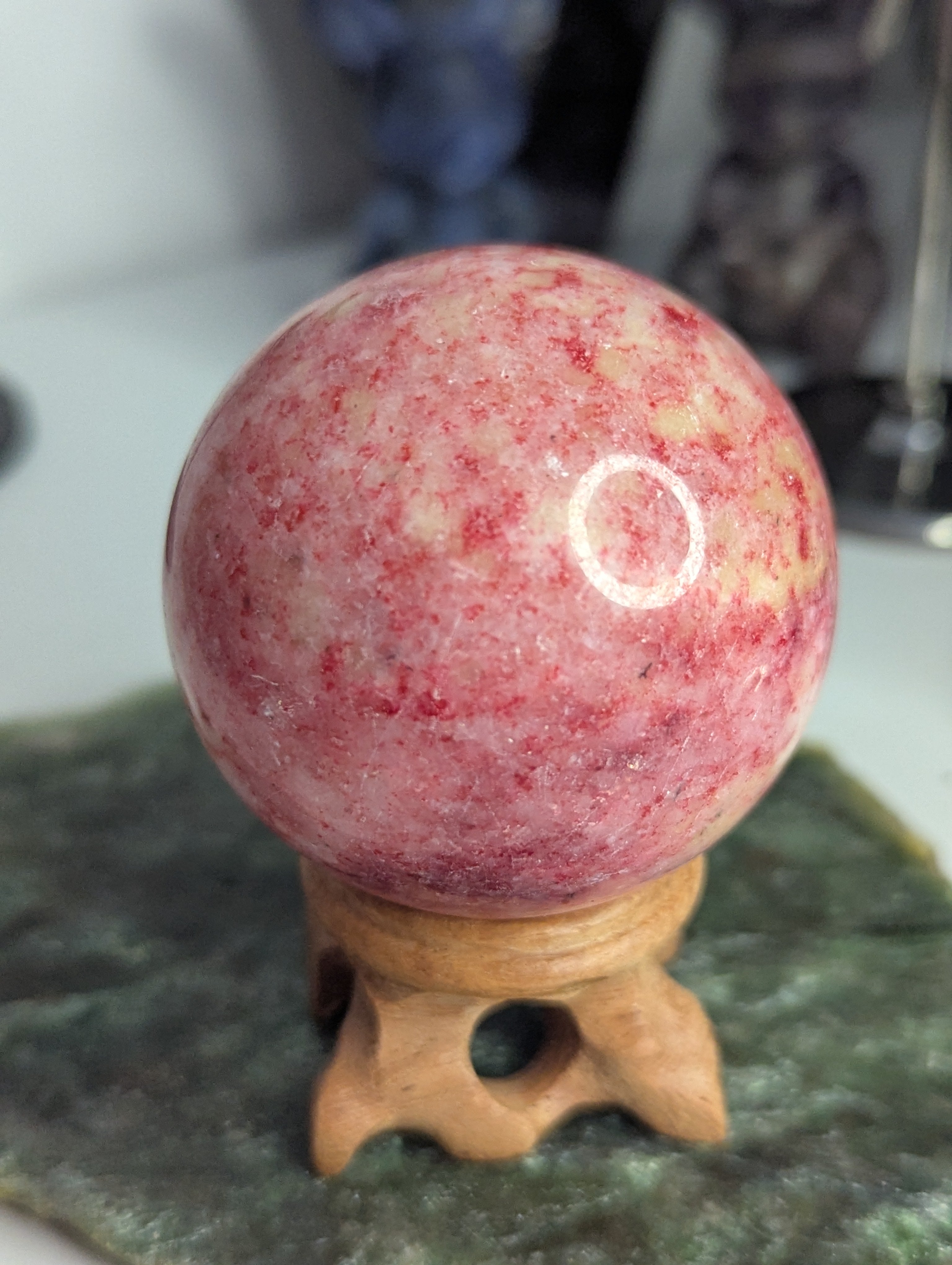 Pink Zoiltie crystal sphere with Orange UV