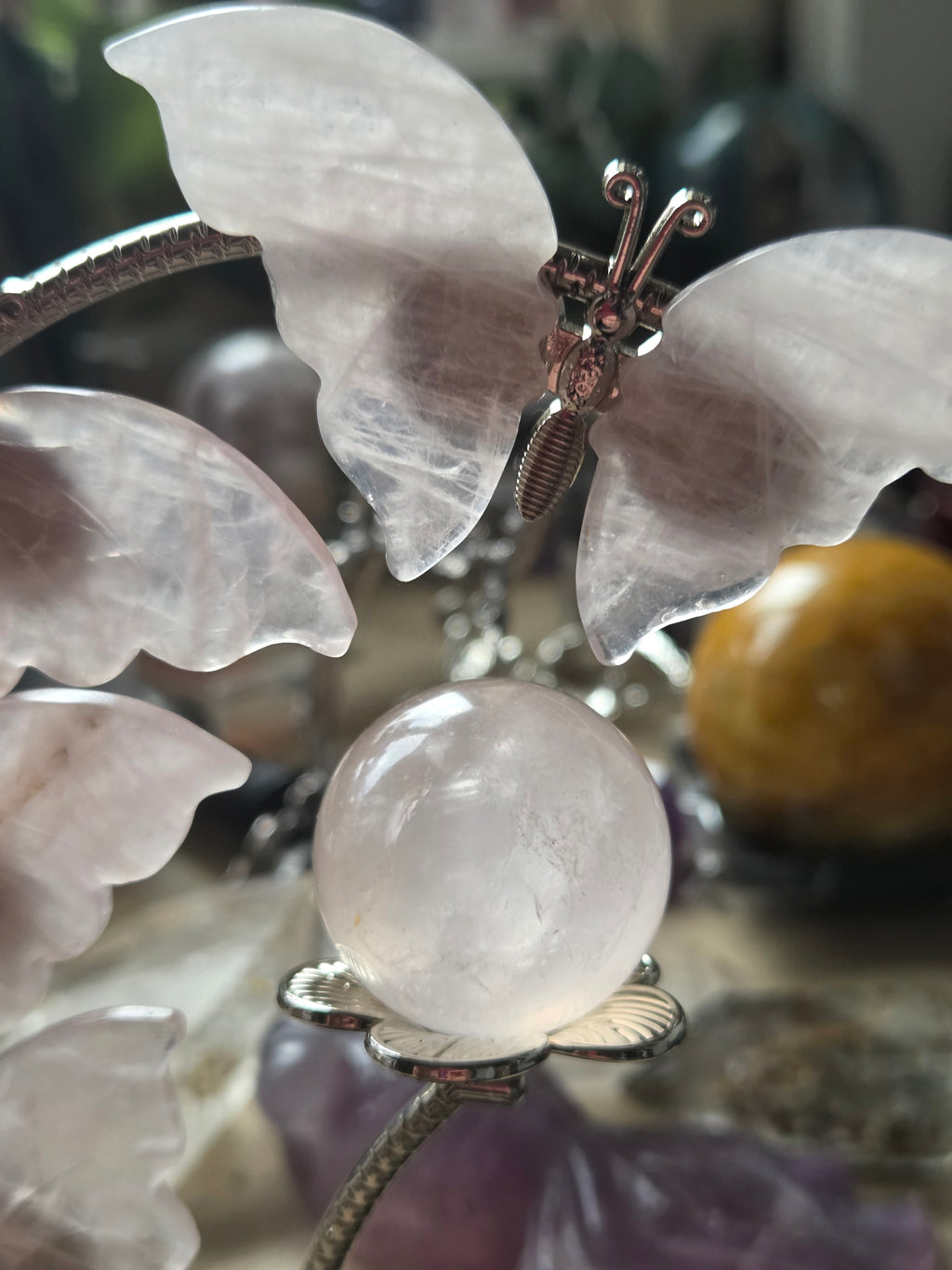 Rose quartz crystal sphere and  butterfly stand
