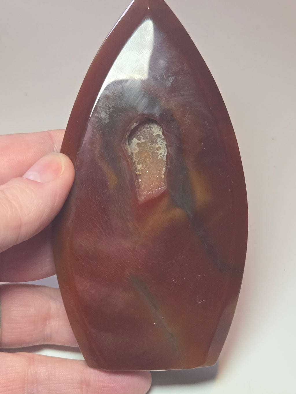 Carnelian crystal drop with imperfections
