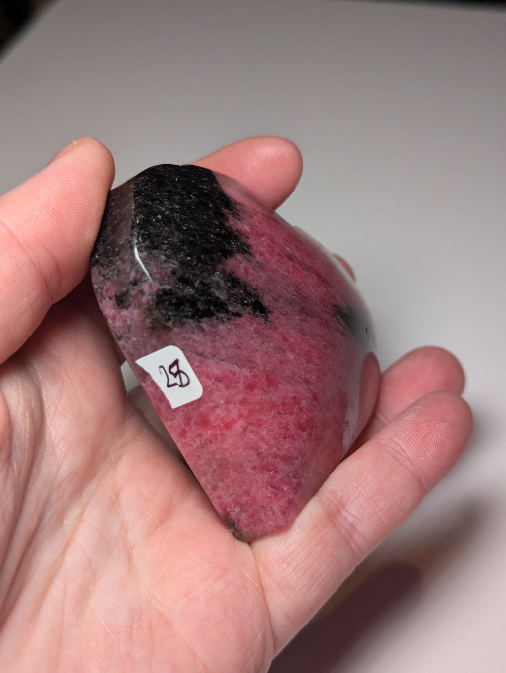 Large Rhodonite crystal heart carving with stand