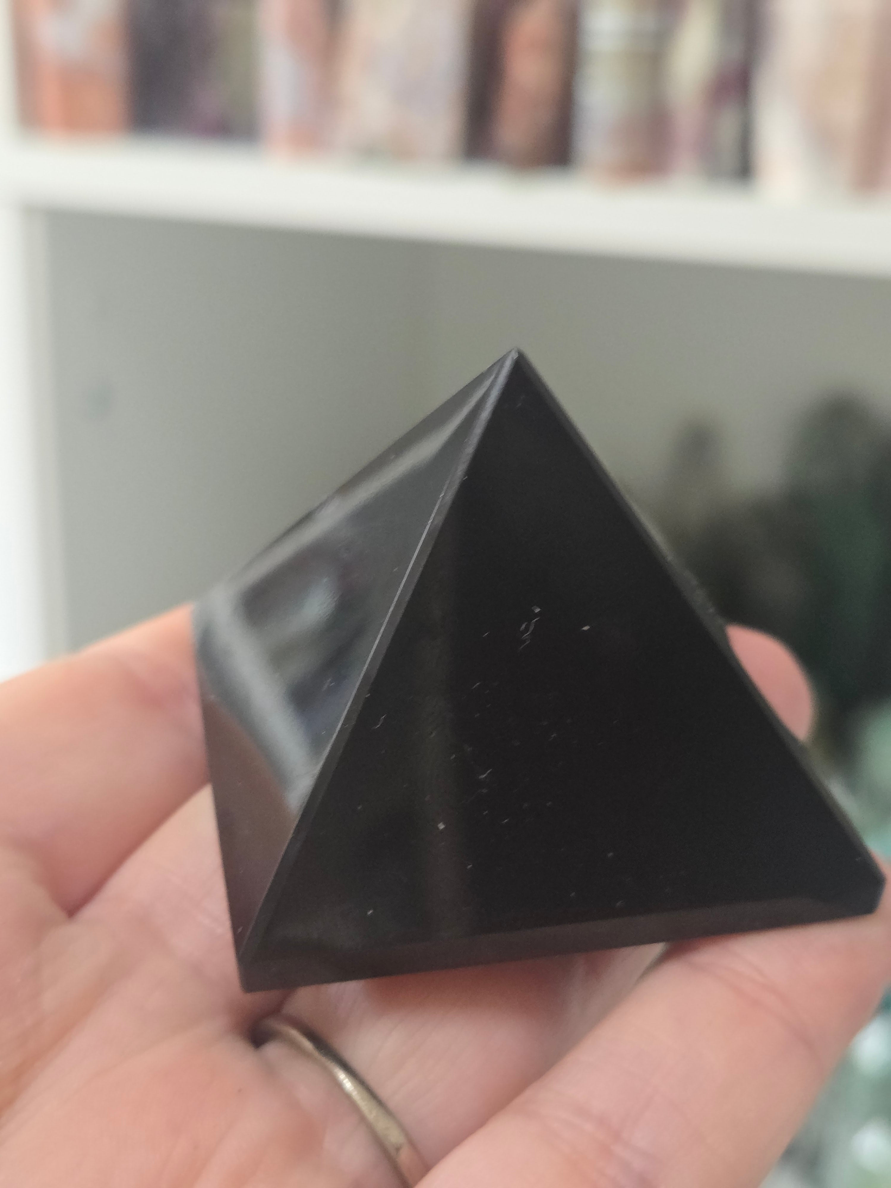 Black obsidian crystal pyramid carving