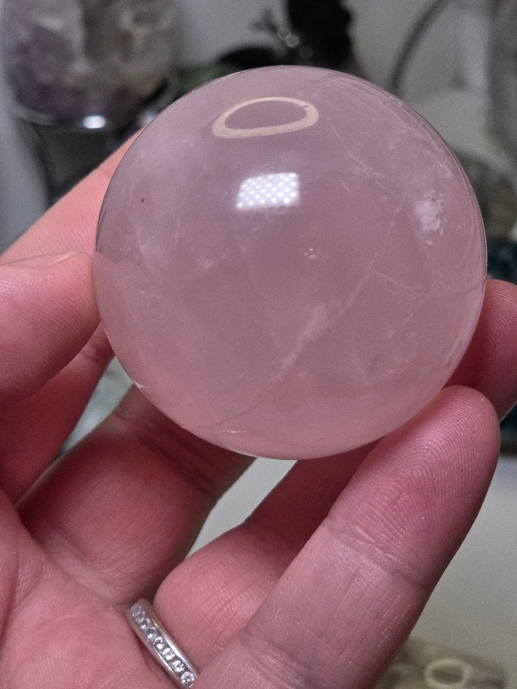 Rose quartz crystal sphere with  crack line and star flash
