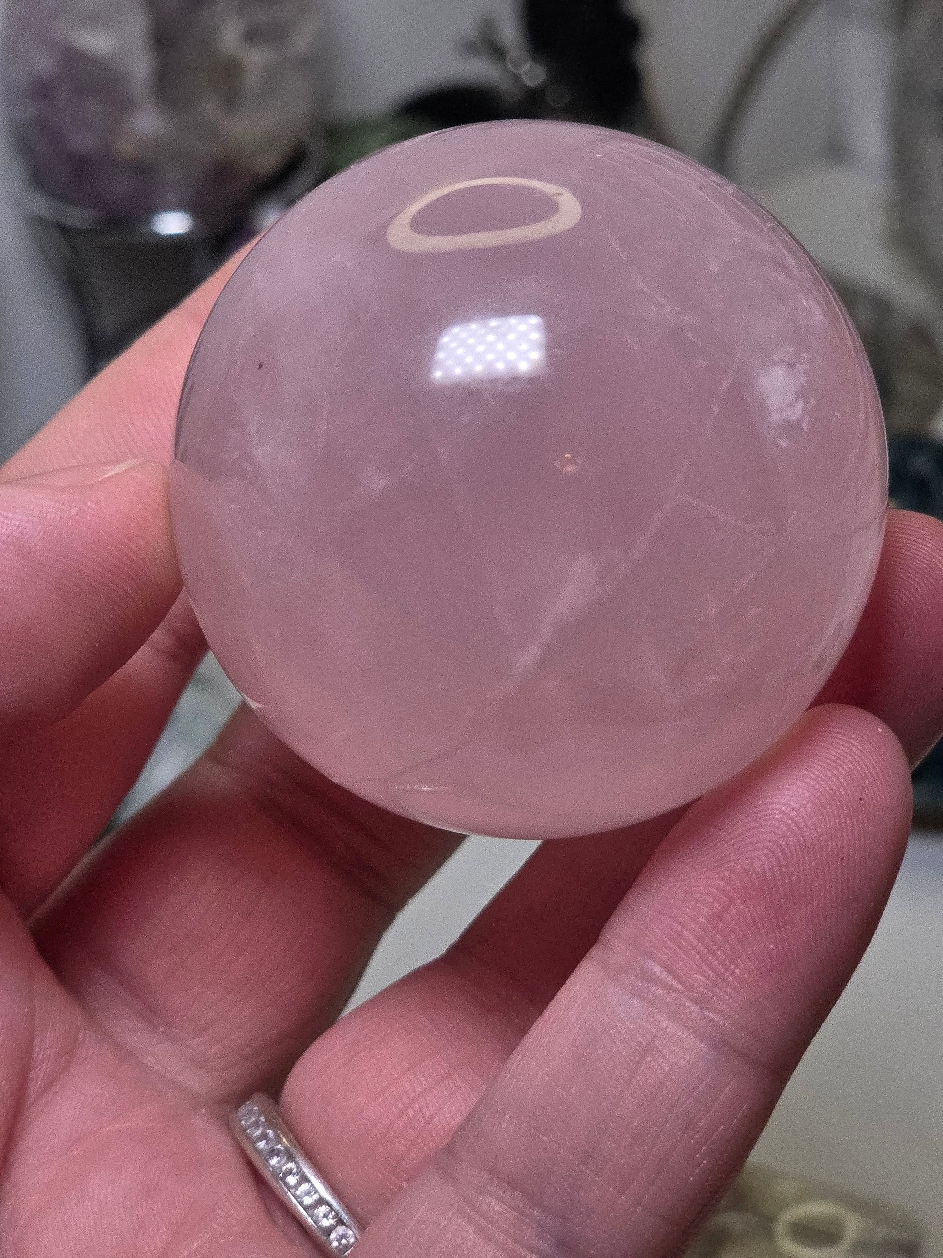 Rose quartz crystal sphere with  crack line and star flash