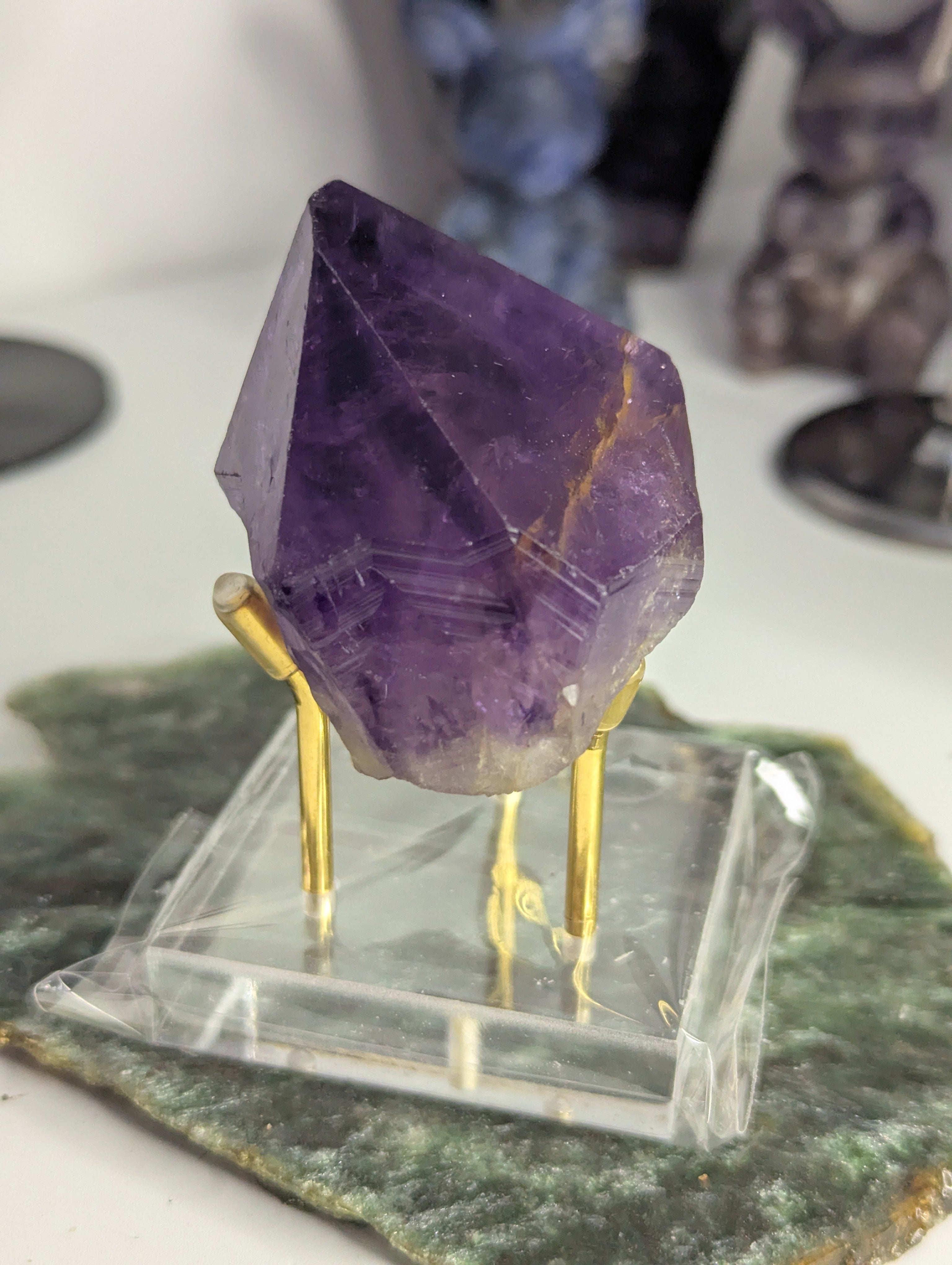 Amethyst crystal tooth from Brazil with stand