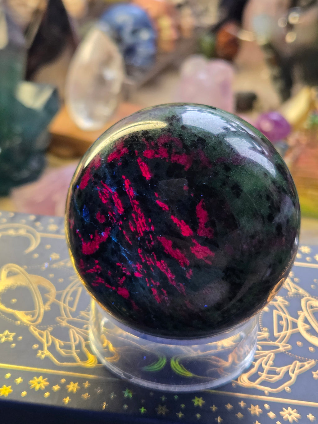 Ruby in zoisite crystal sphere carving