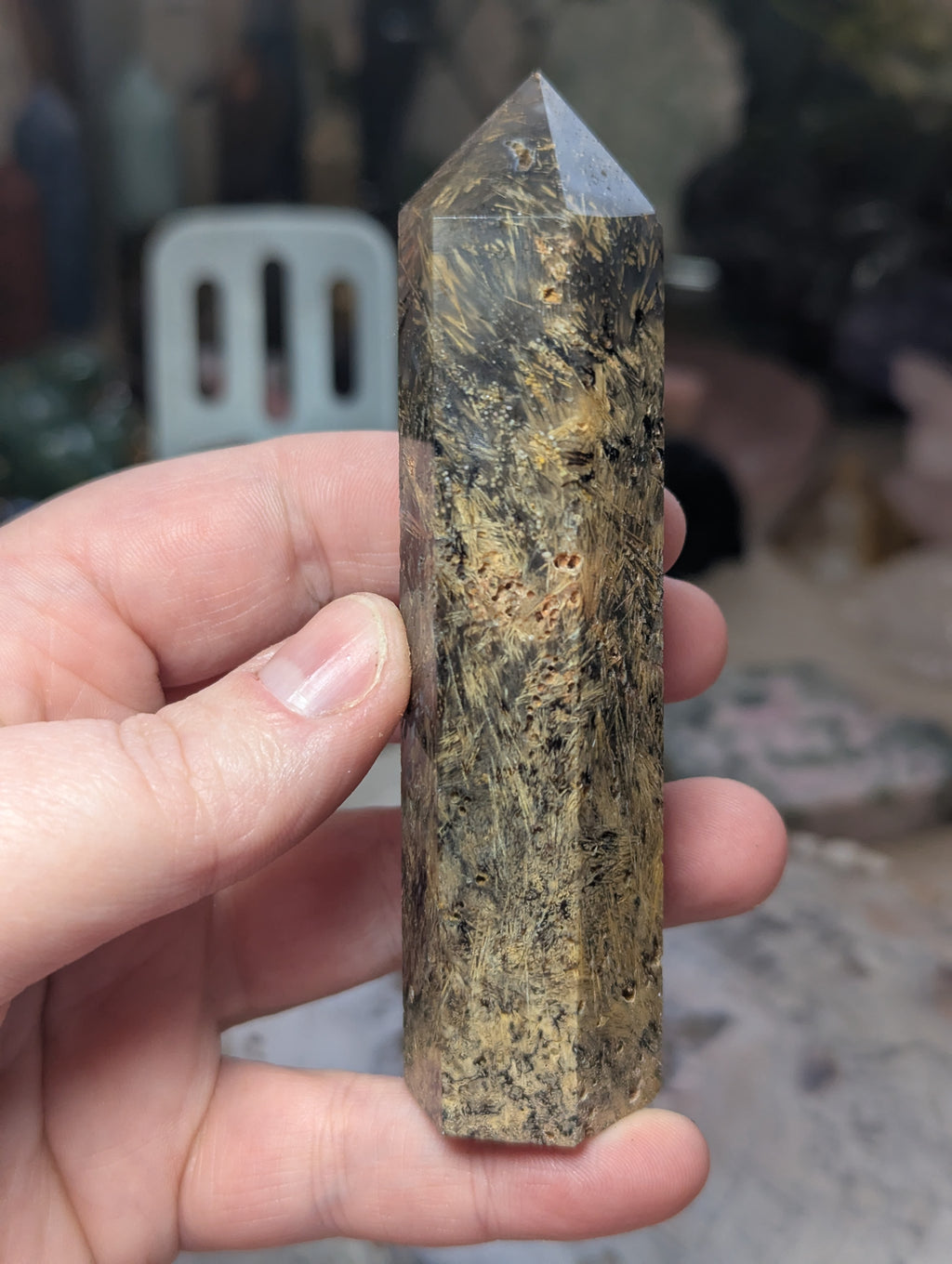 Golden rutile in black agate tower