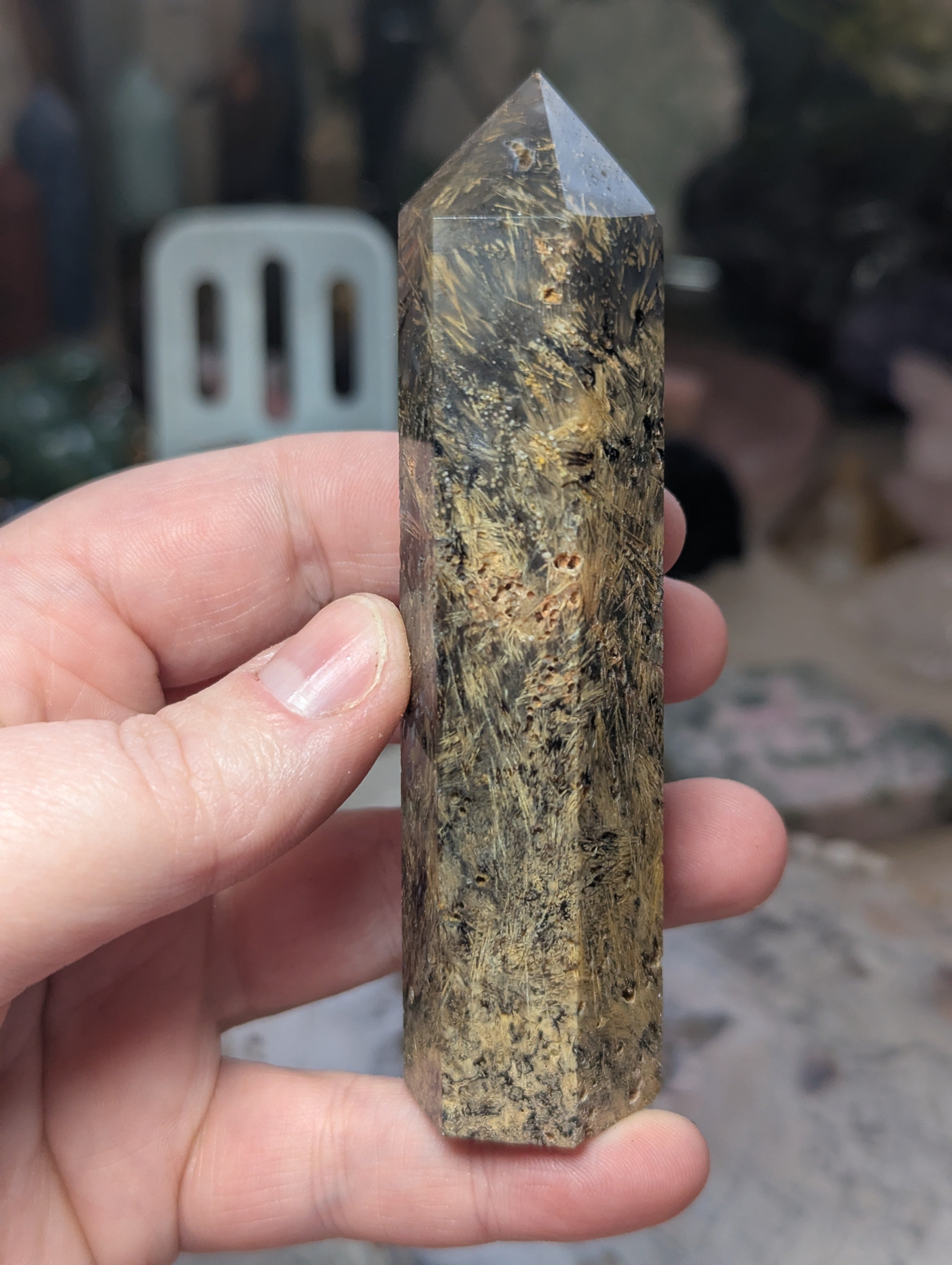 Golden rutile in black agate tower