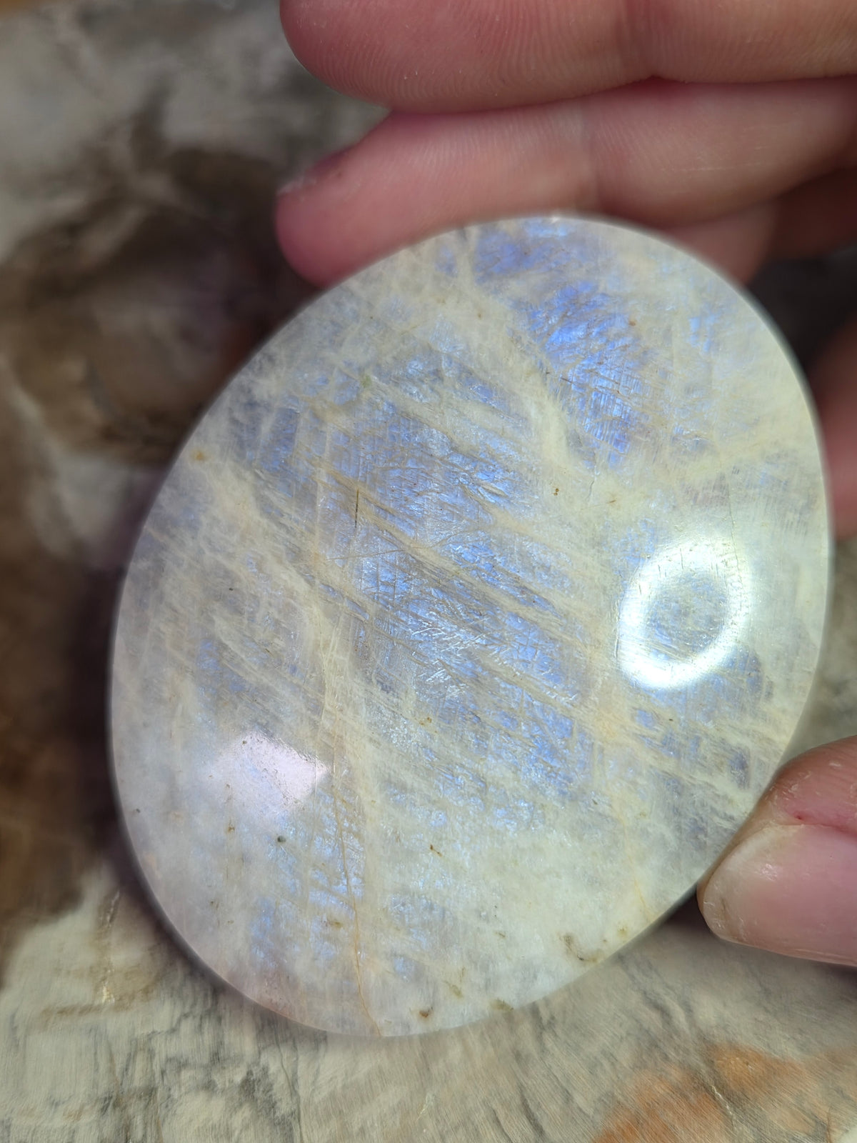 Beautiful crystal moonstone palm stone