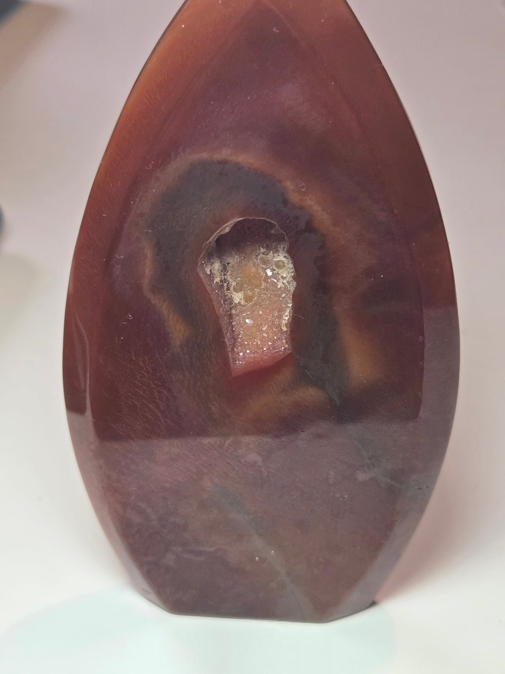 Carnelian crystal drop with imperfections