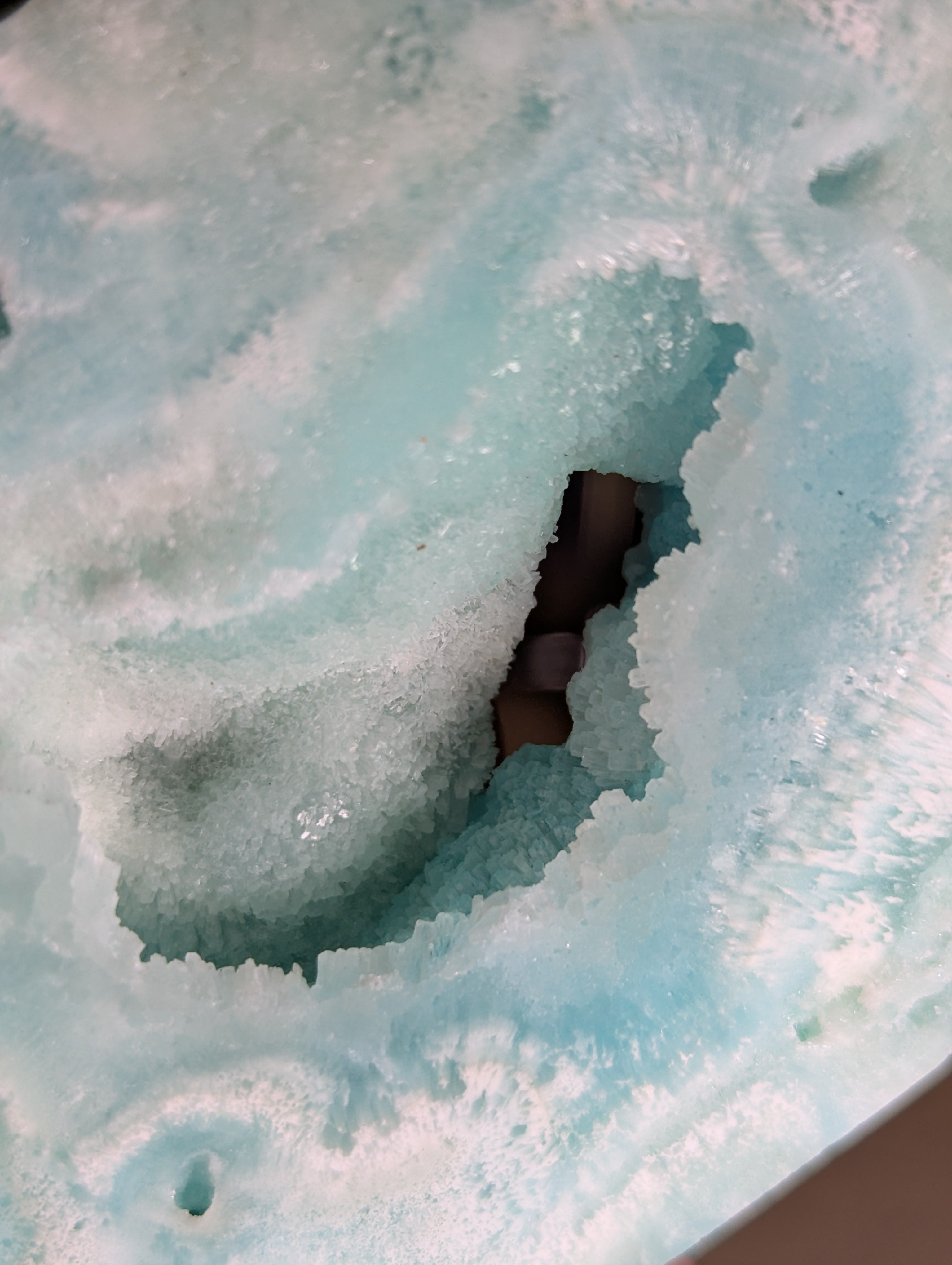 Hemimorphite crystal heart carving with stand