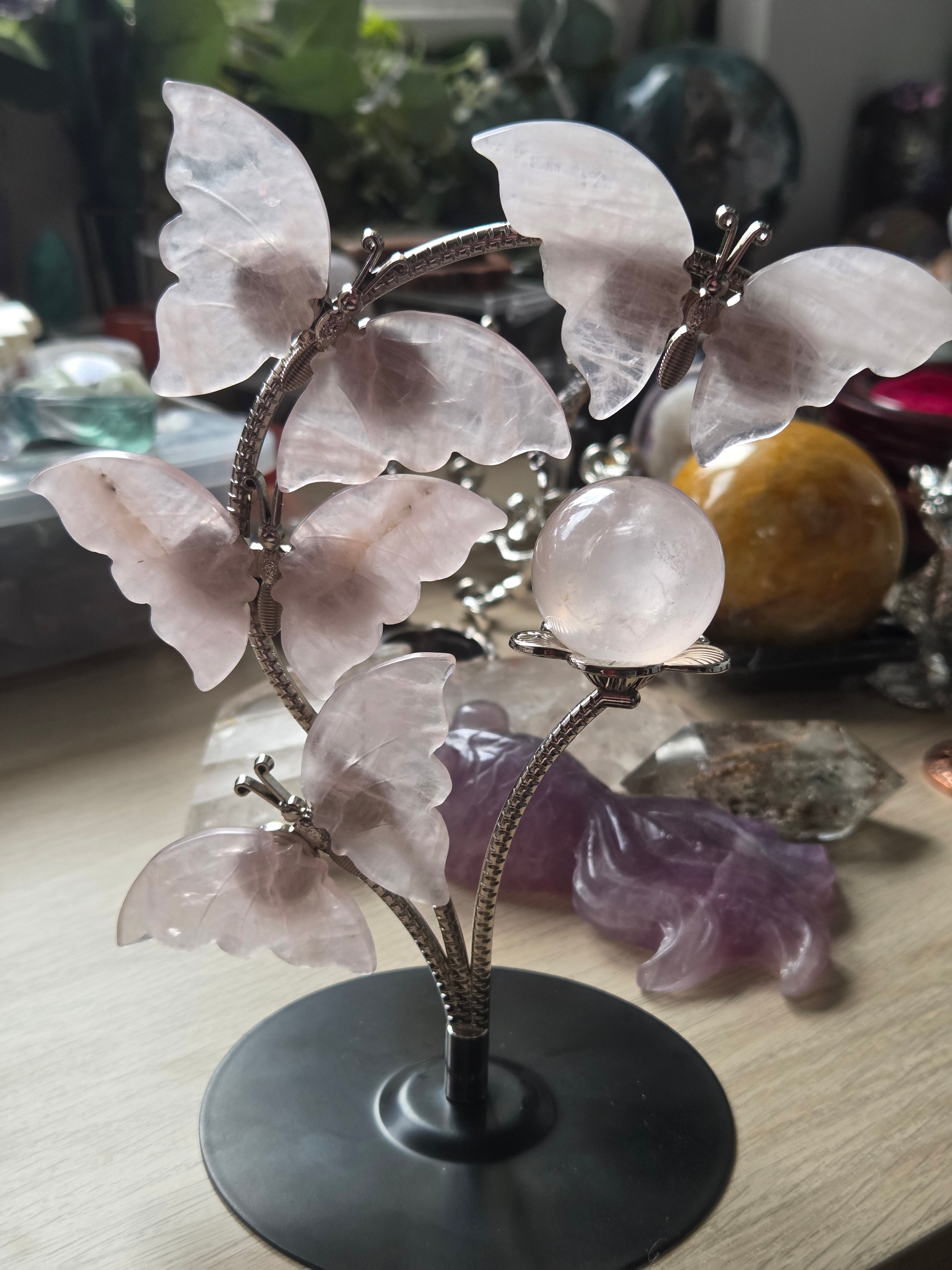 Rose quartz crystal sphere and  butterfly stand