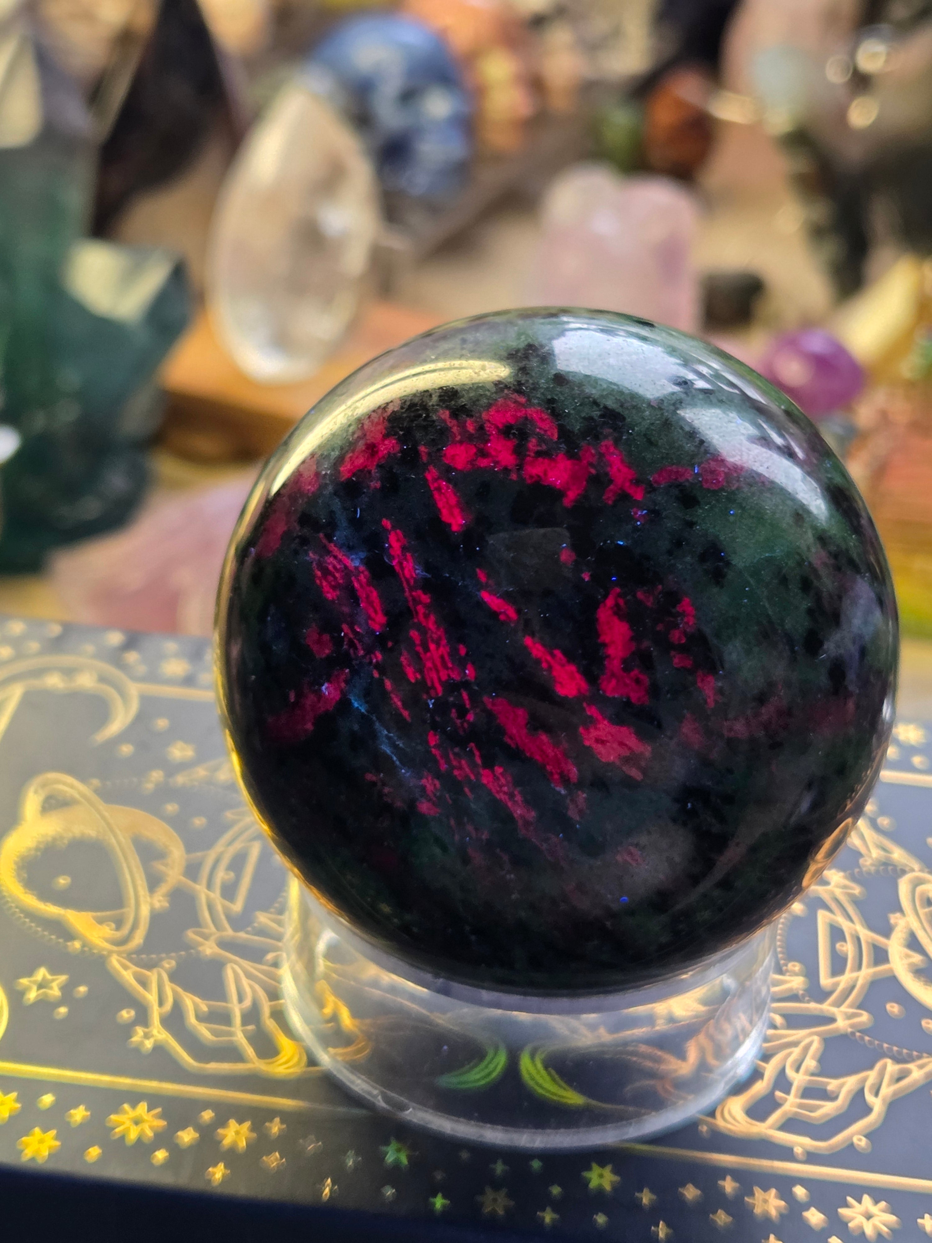 Ruby in zoisite crystal sphere carving