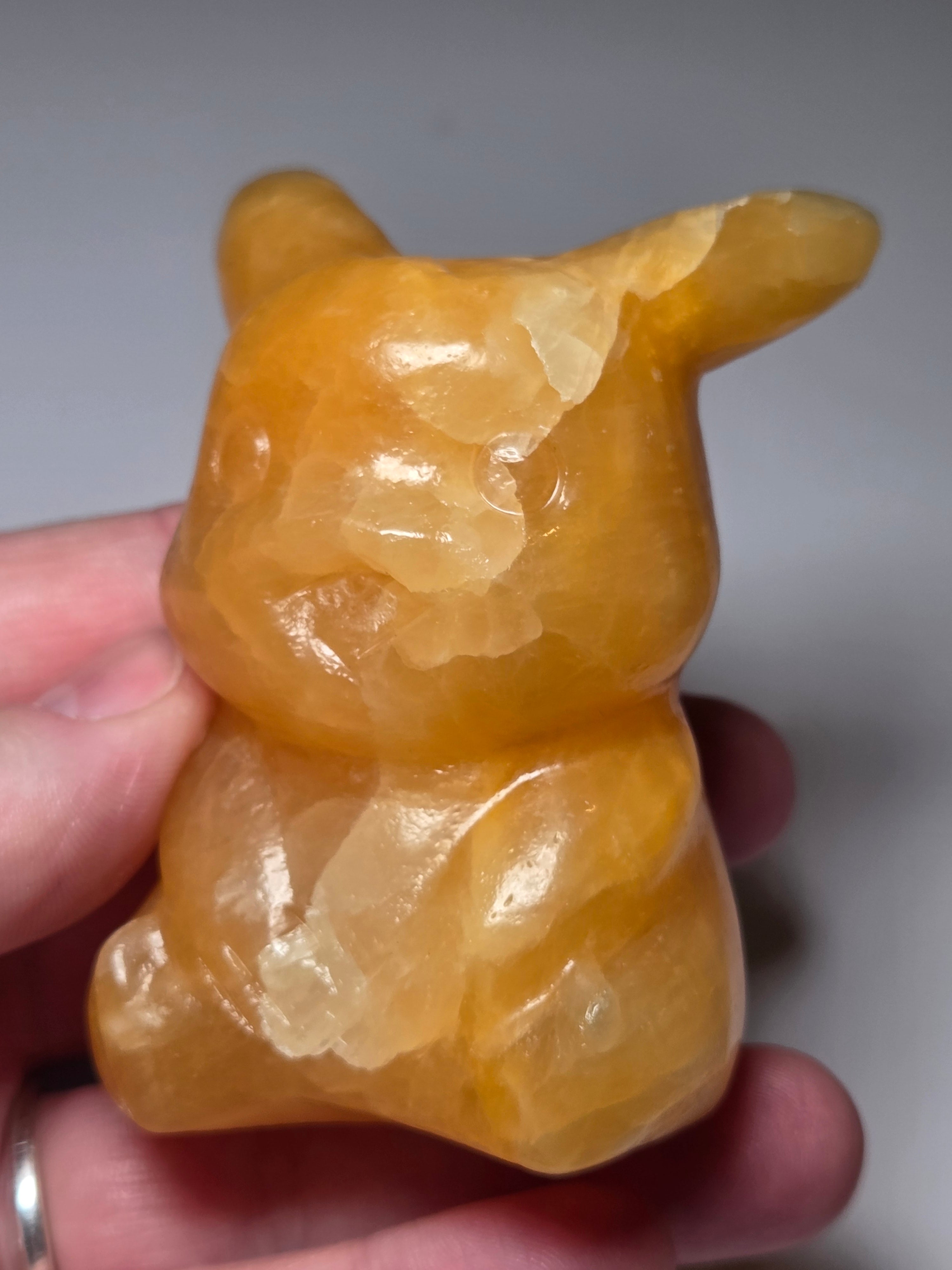 Orange calcite crystal pikachu pokemon carving