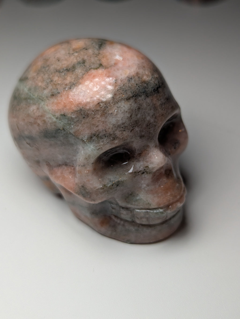 Sunstone crystal skull carving