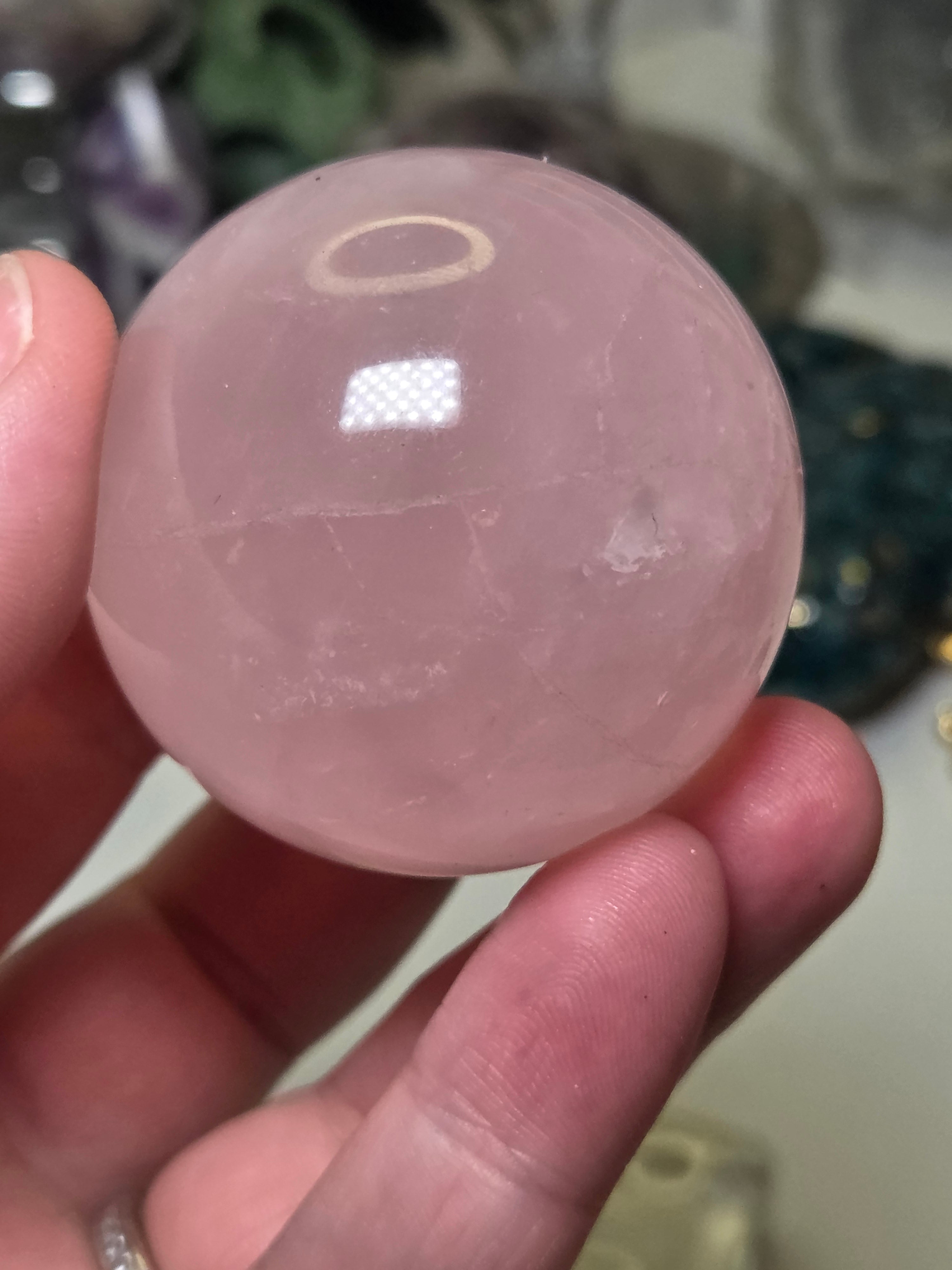 Rose quartz crystal sphere with  crack line and star flash