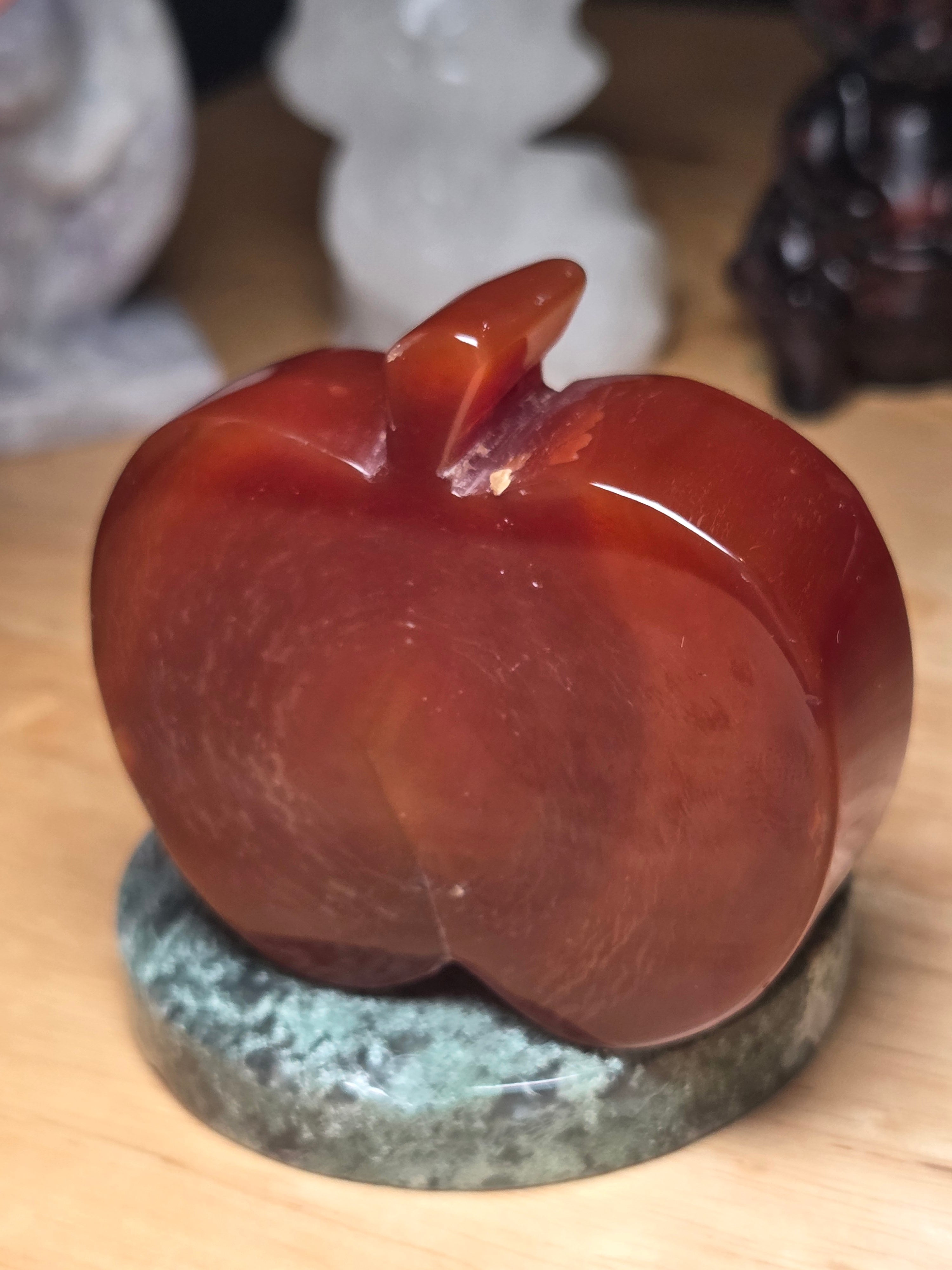 Carnelian crystal apple with imperfections