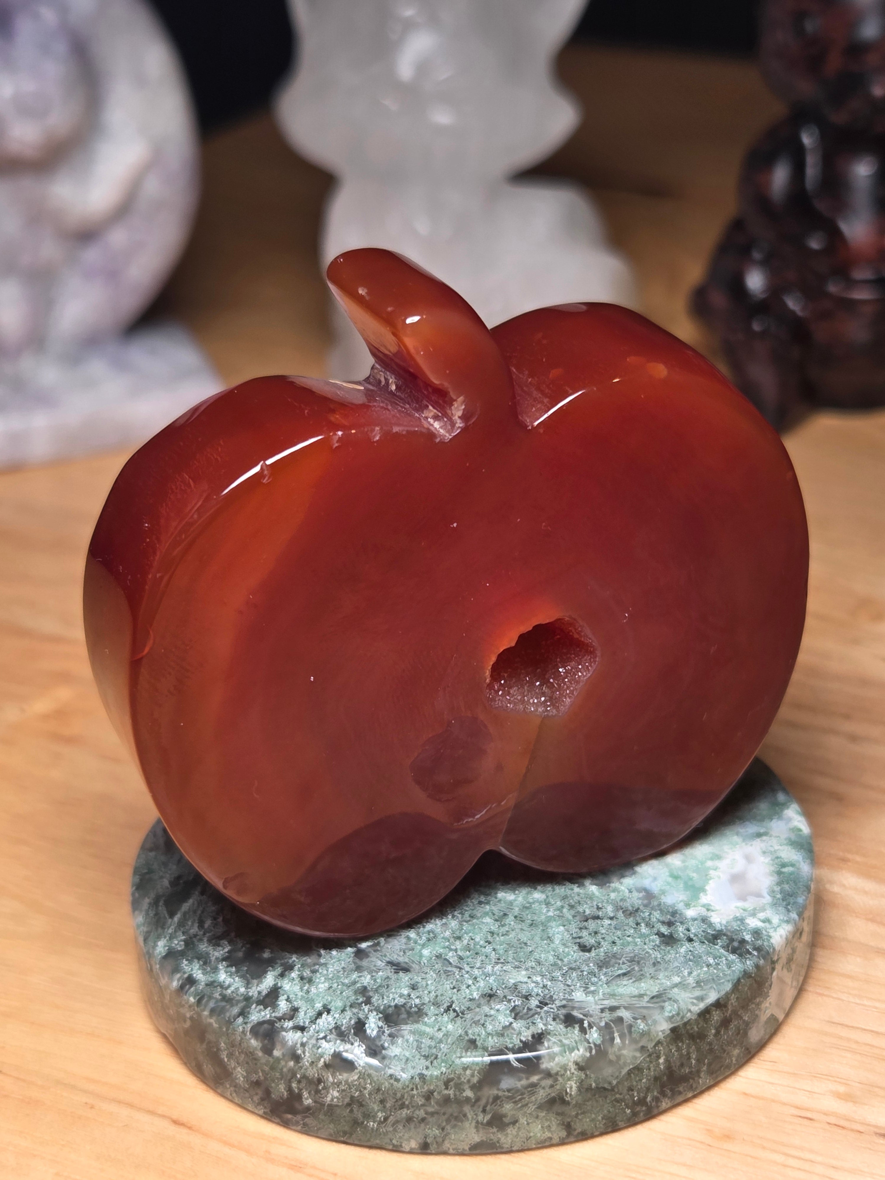 Carnelian crystal apple with imperfections