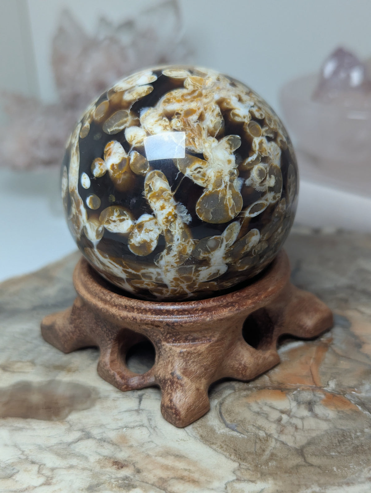 Natural Amber with calcite crystal sphere