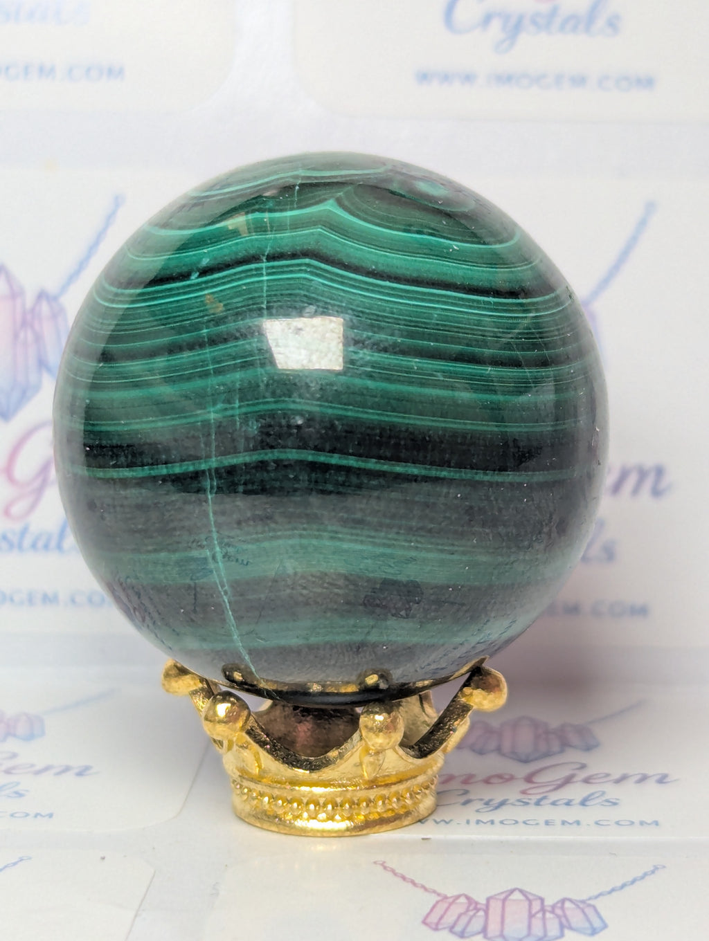 Malicite crystal sphere with imperfections