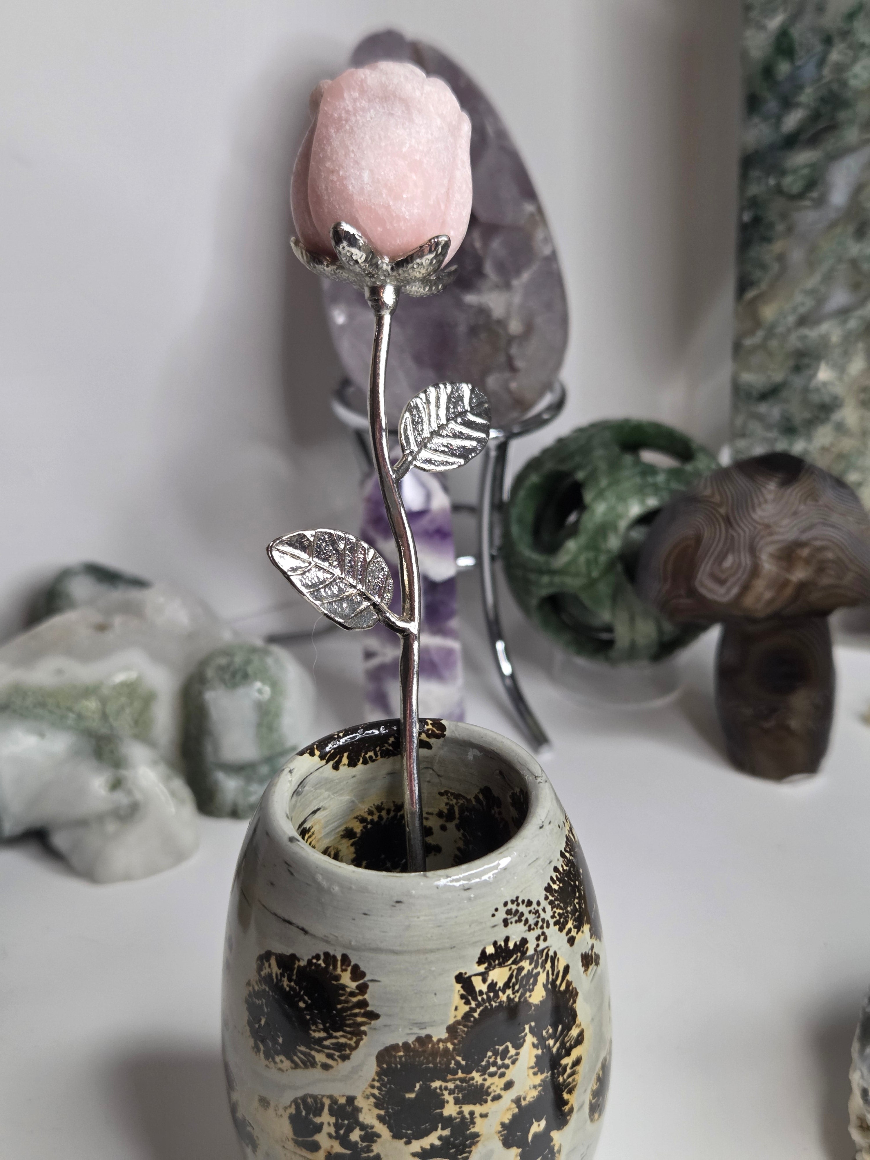 Pink opal crystal rose on stand