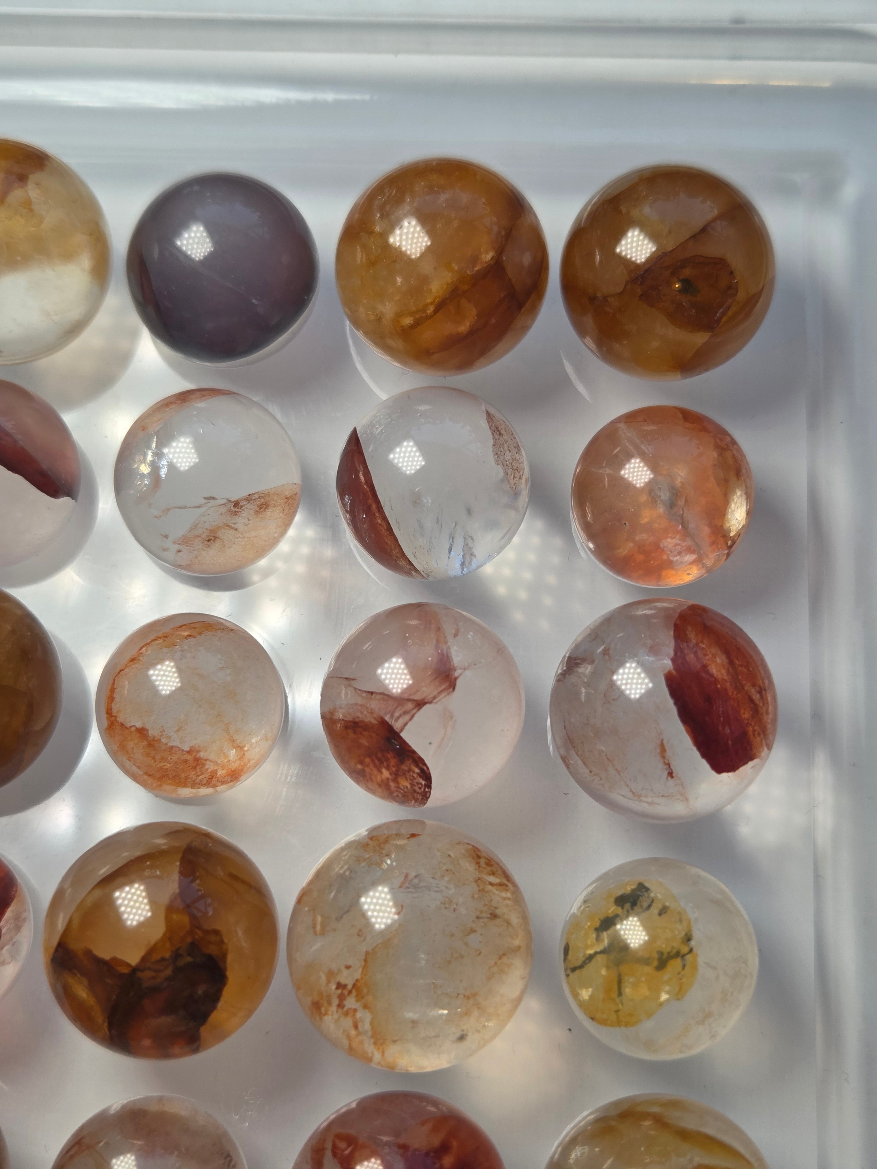Mini crystal sphere fire quartz and golden healer- with stand