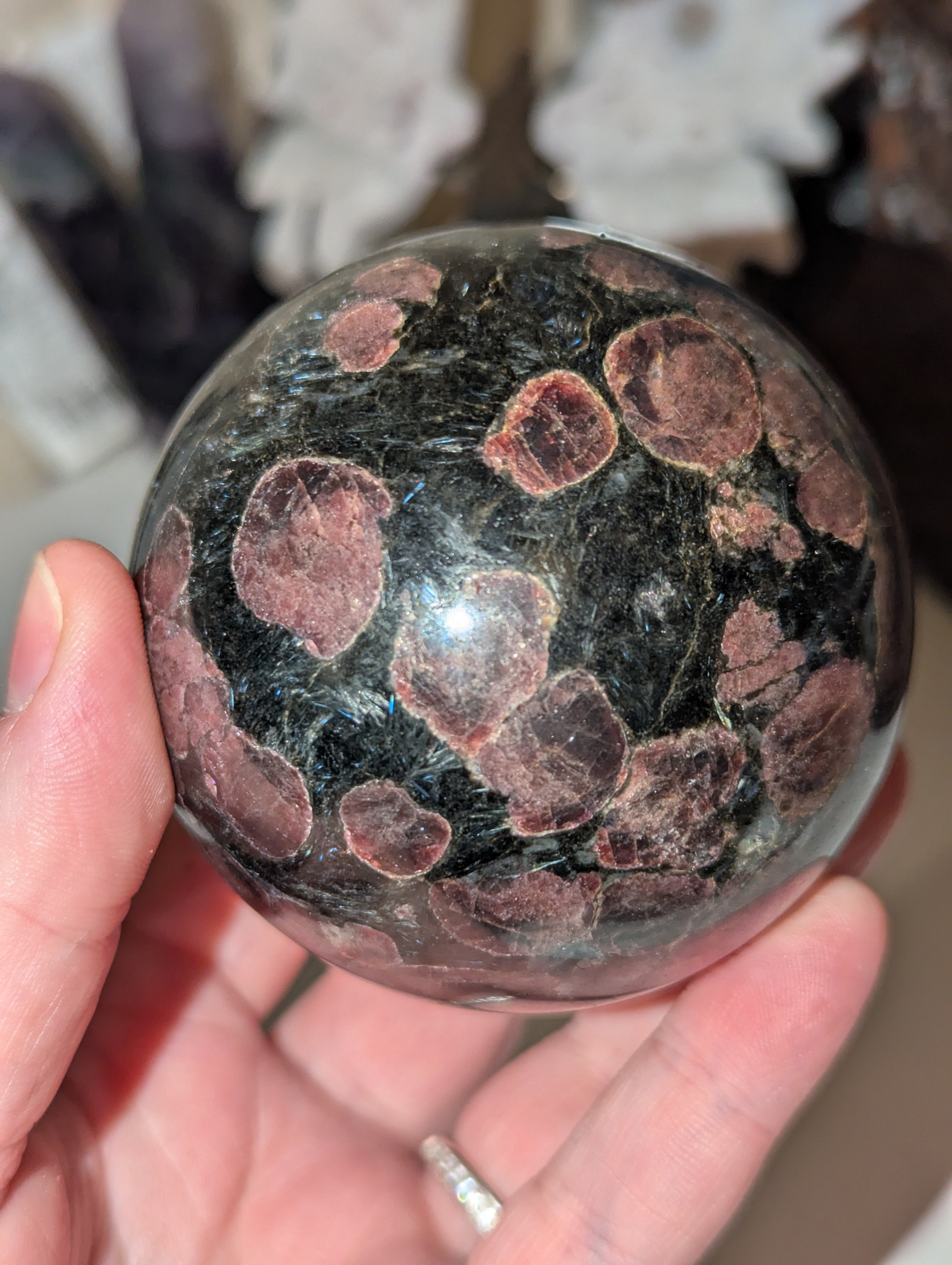 Astrophylite crystal sphere with garnet