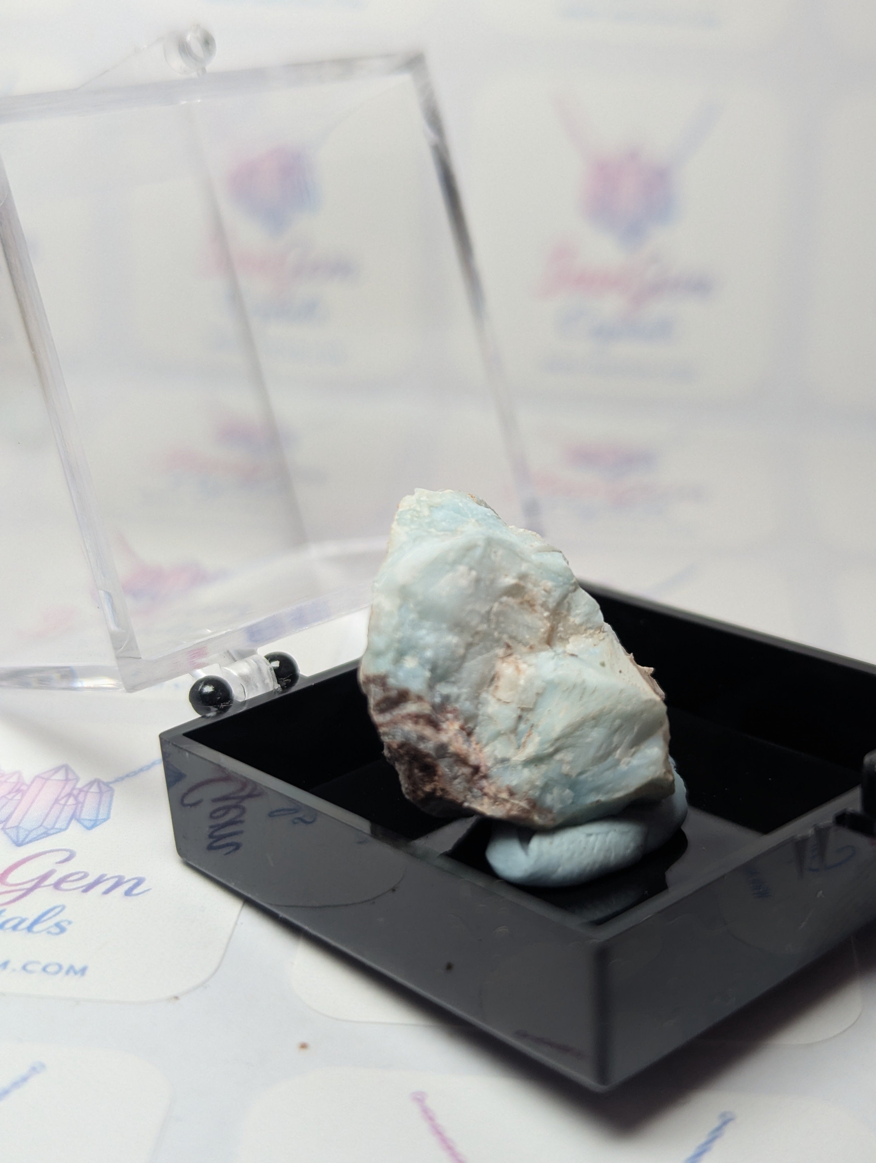 Raw Larimar crystal specimen with box