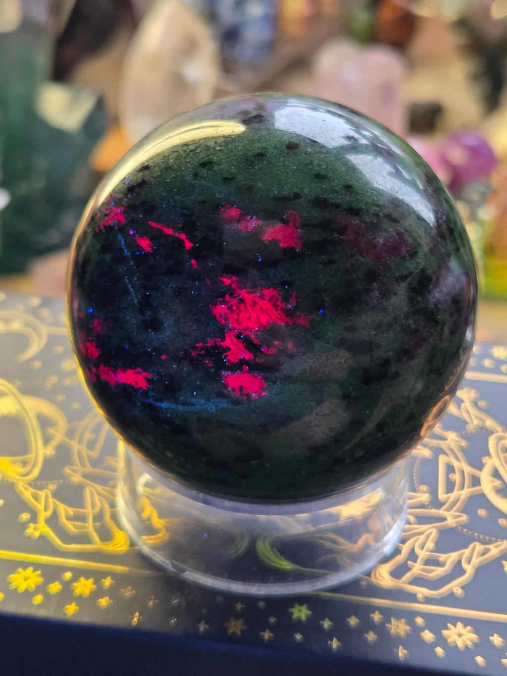 Ruby in zoisite crystal sphere carving