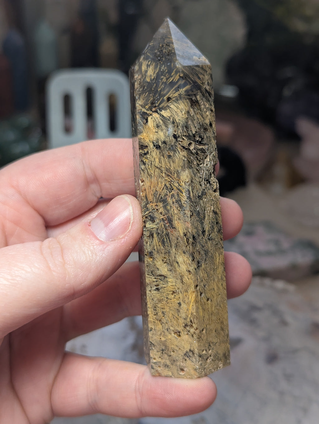 Golden rutile in black agate tower