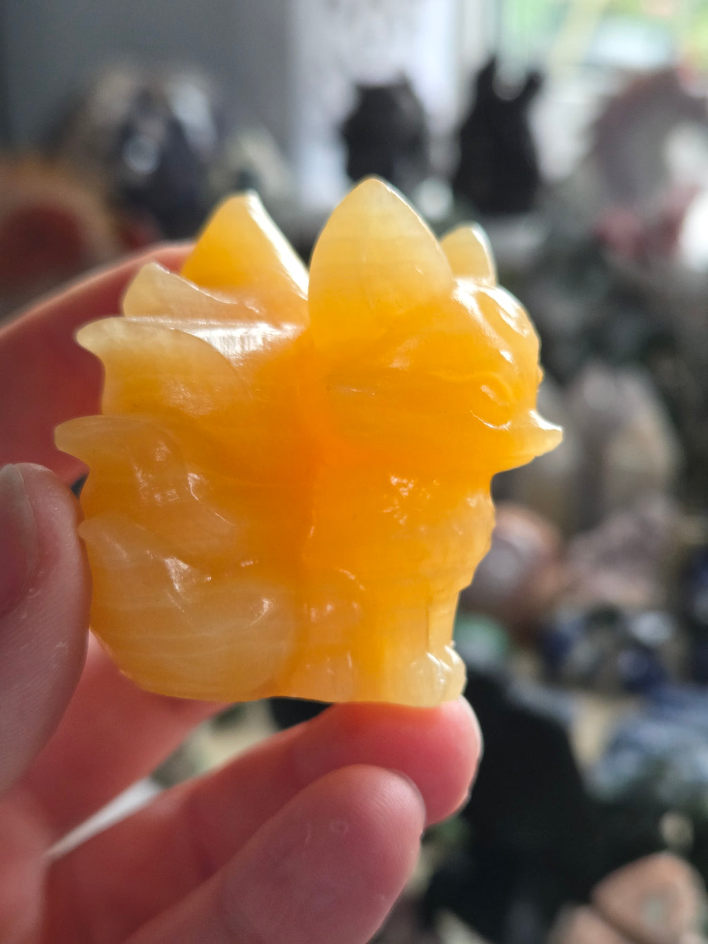 Orange calcite crystal nine tail fox