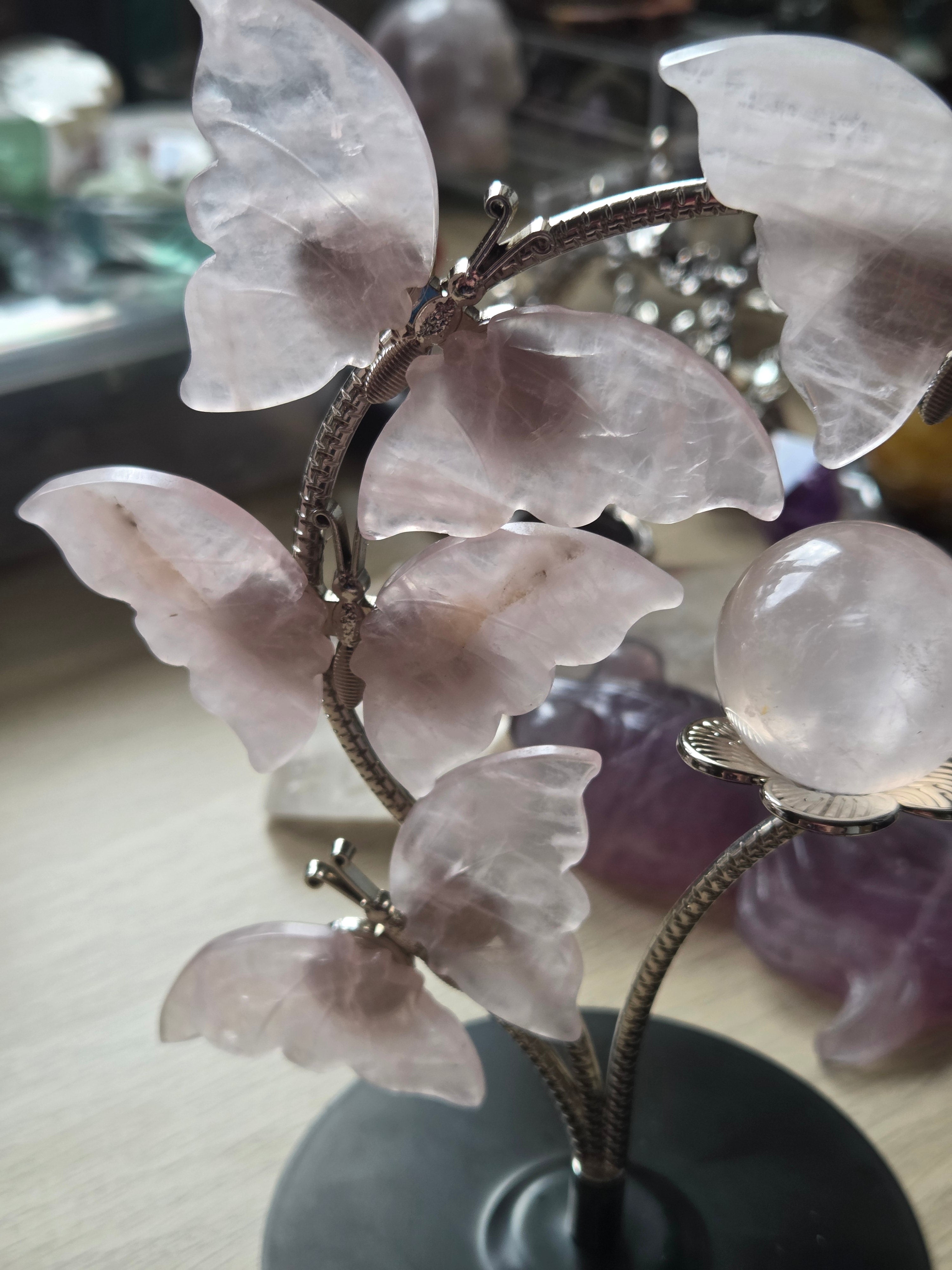 Rose quartz crystal sphere and  butterfly stand