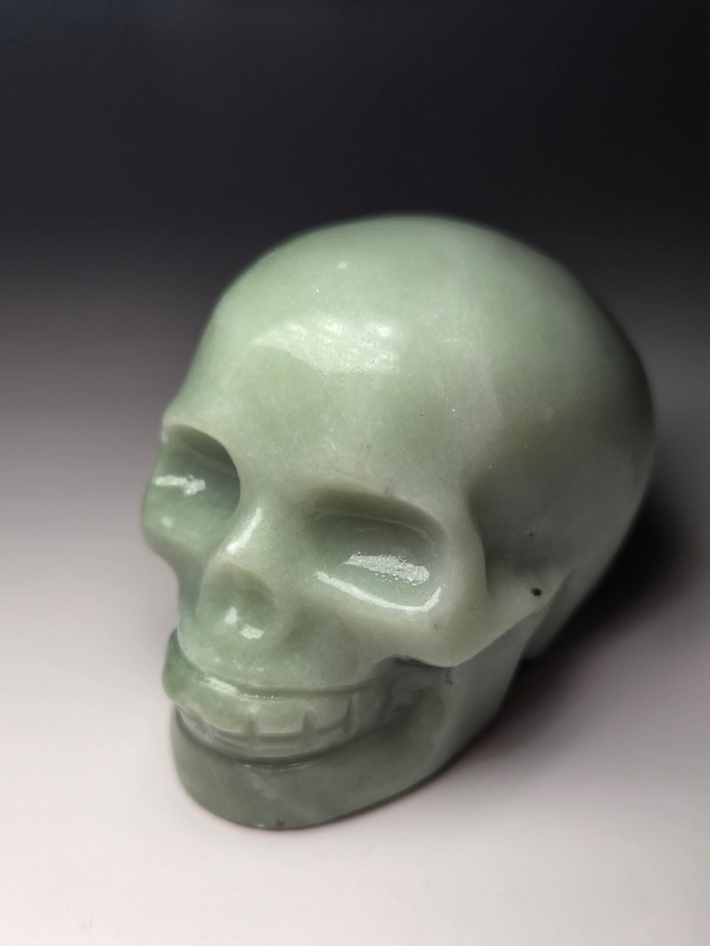 Green jade crystal skull carving