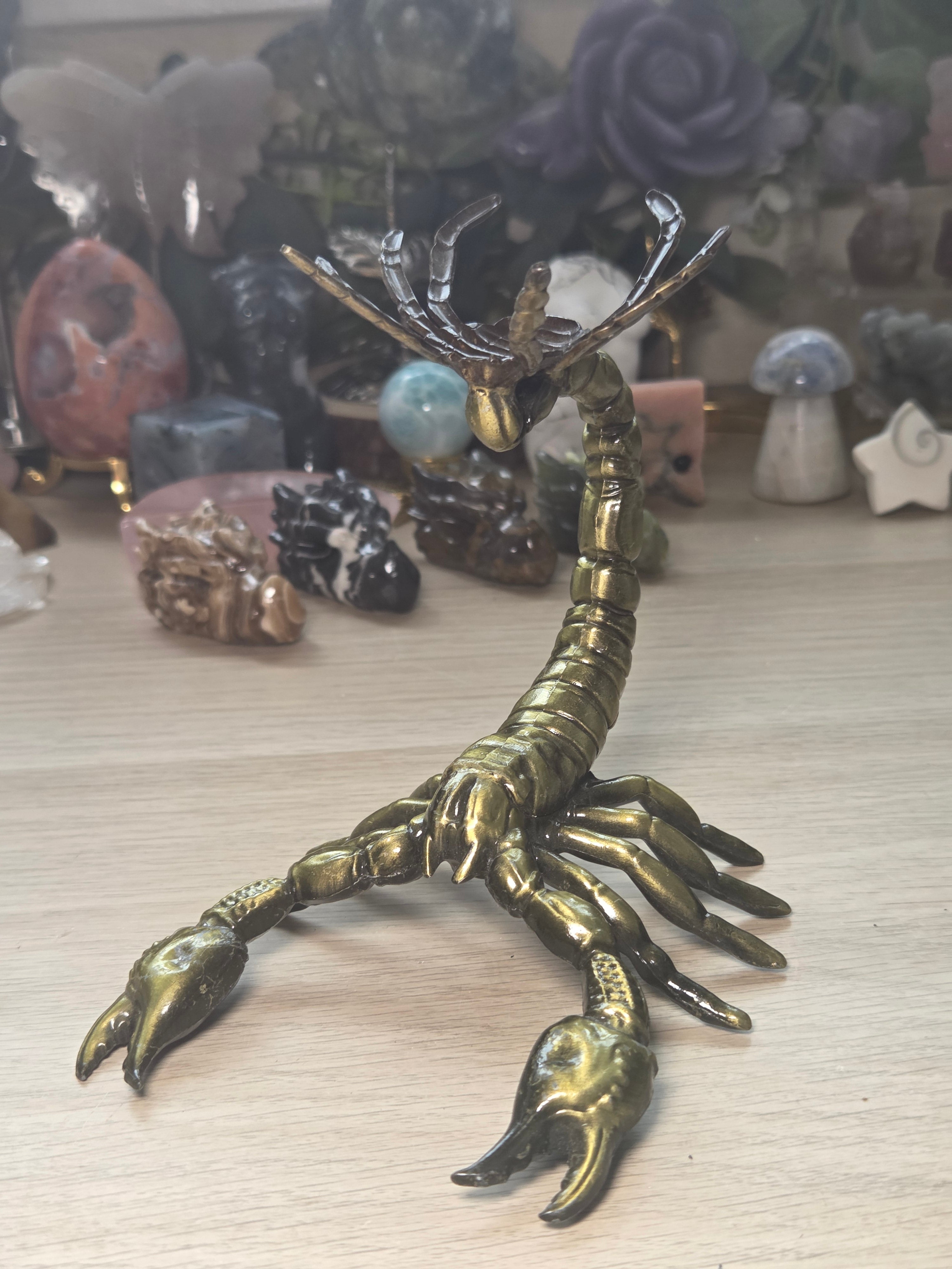 Golden scorpion sphere stand