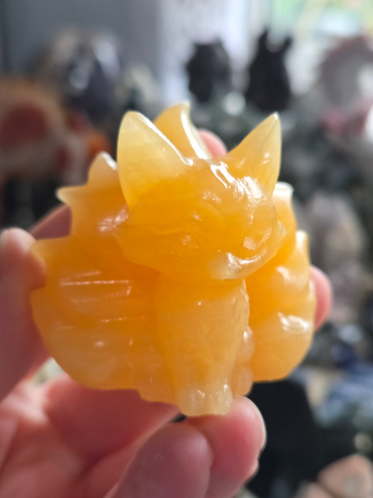 Orange calcite crystal nine tail fox