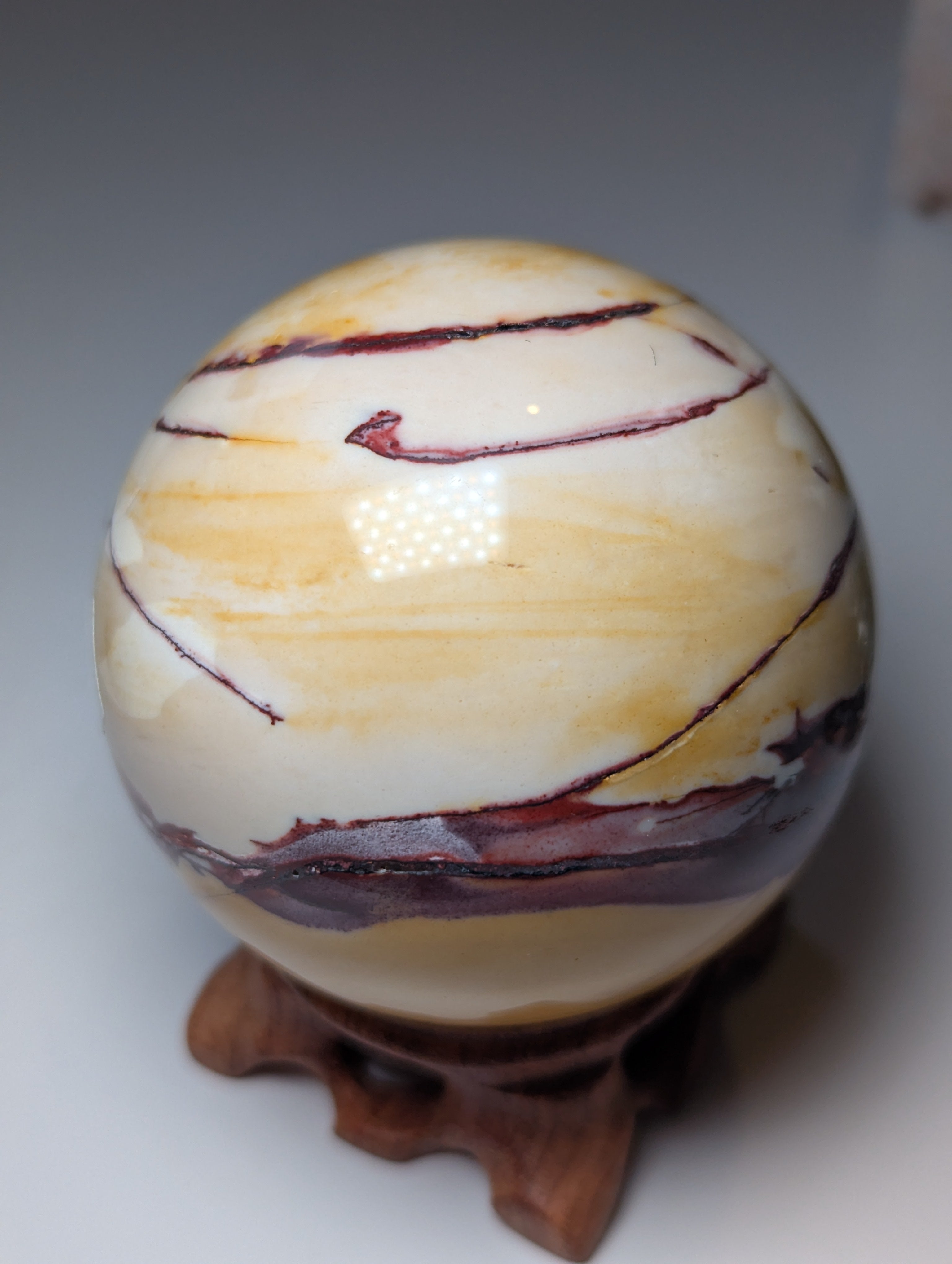 Mookaite crystal sphere with stand