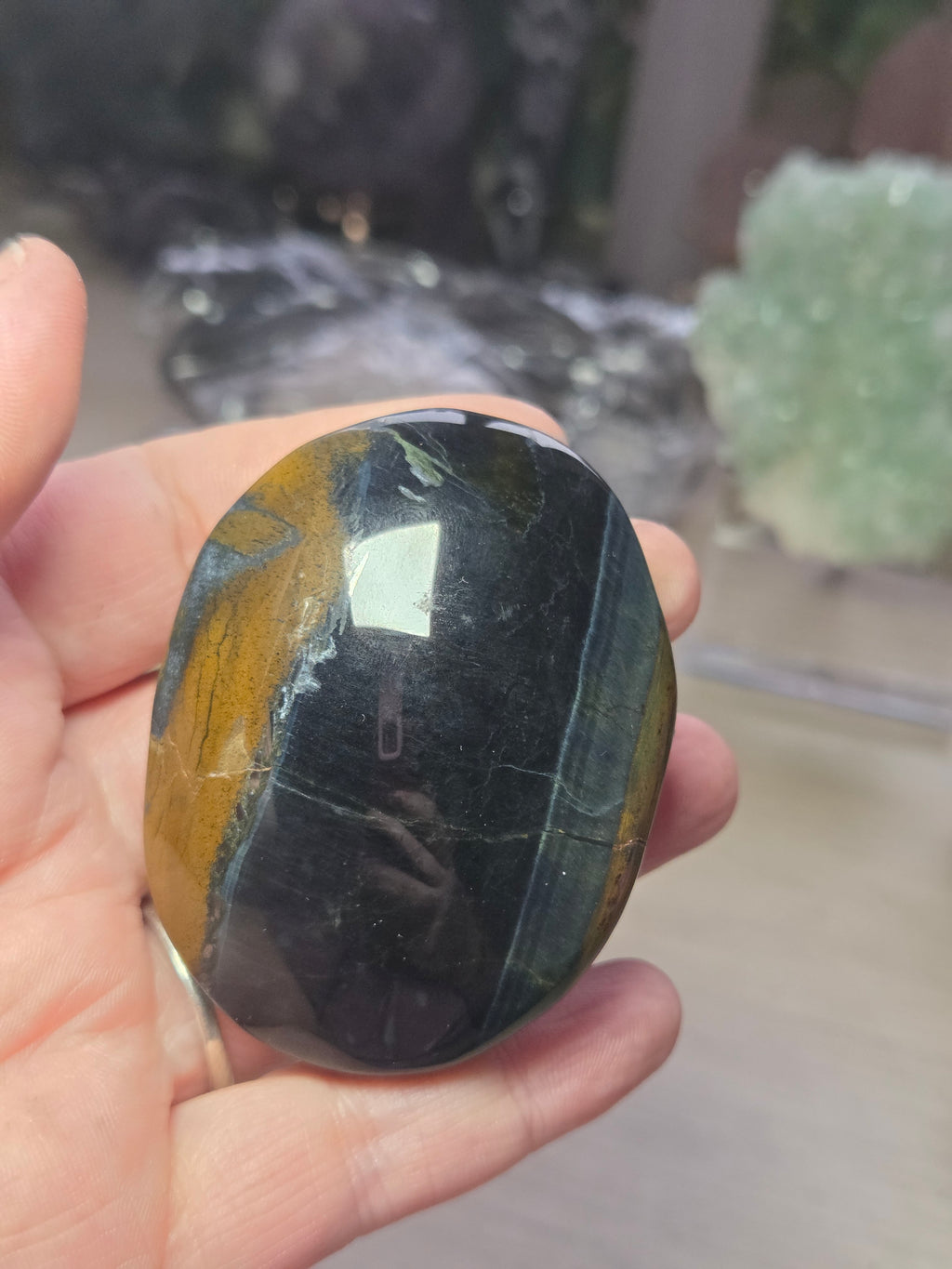 Tigers eye palm stone with Imperfections