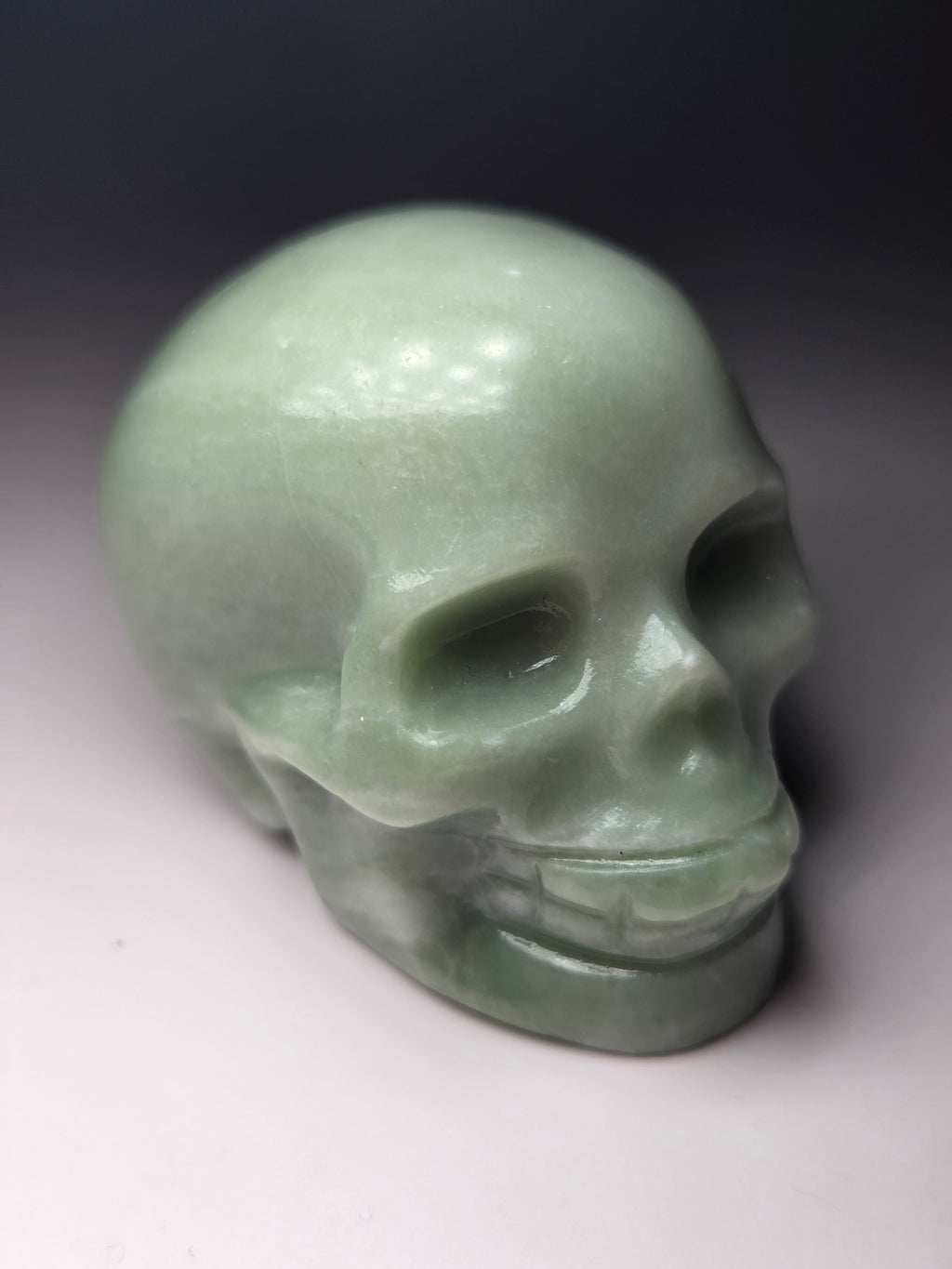 Green jade crystal skull carving