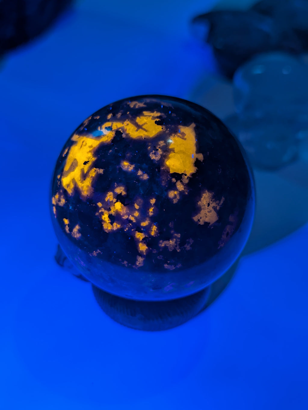 Yooperlite crystal sphere with Orange UV