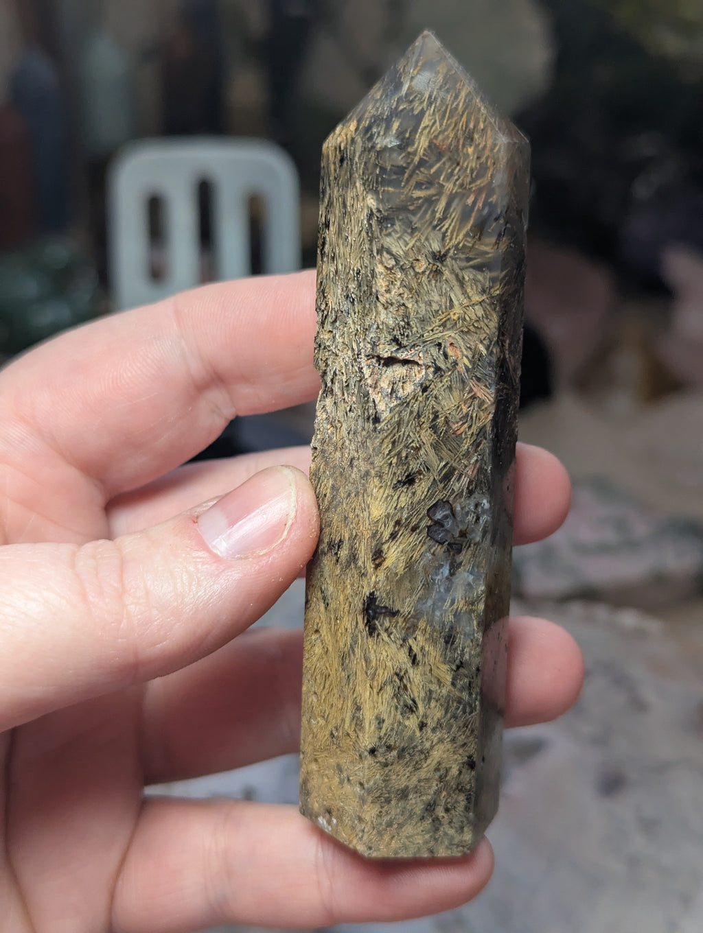 Golden rutile in black agate tower