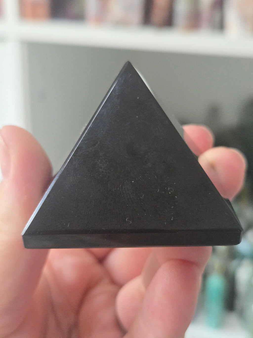 Black obsidian crystal pyramid carving