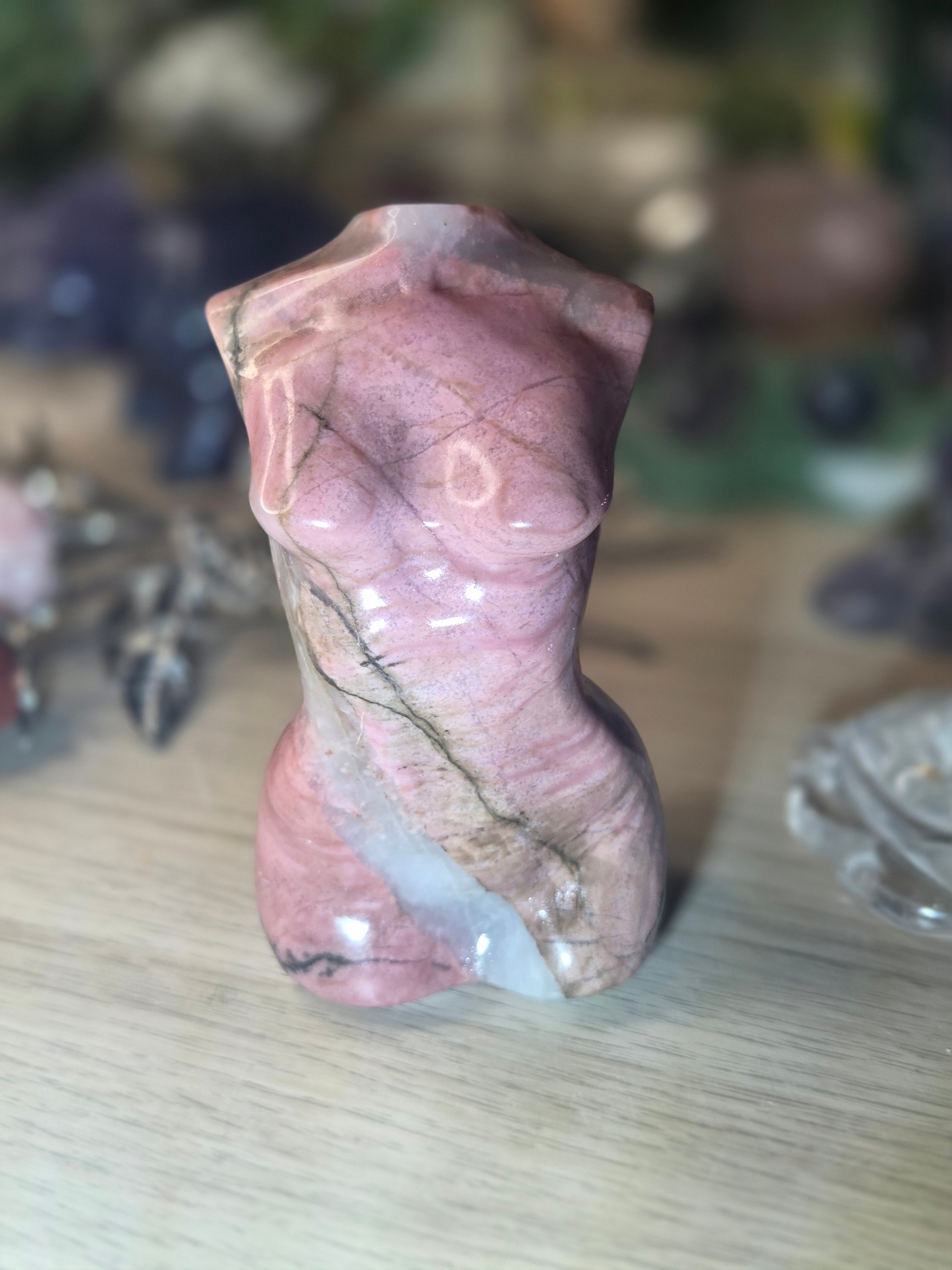 Rhodonite crystal female body carving