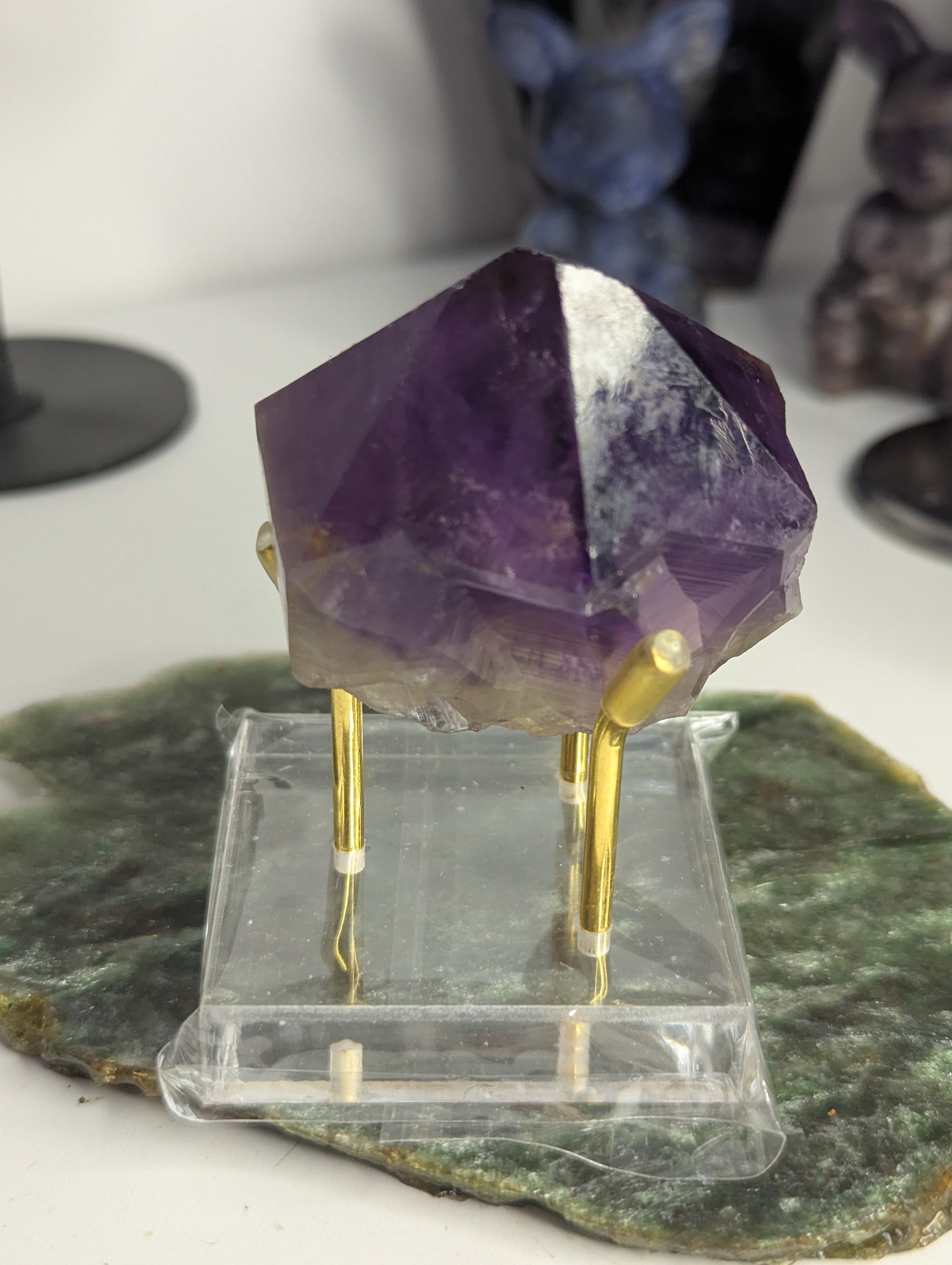 Amethyst crystal tooth from Brazil with stand