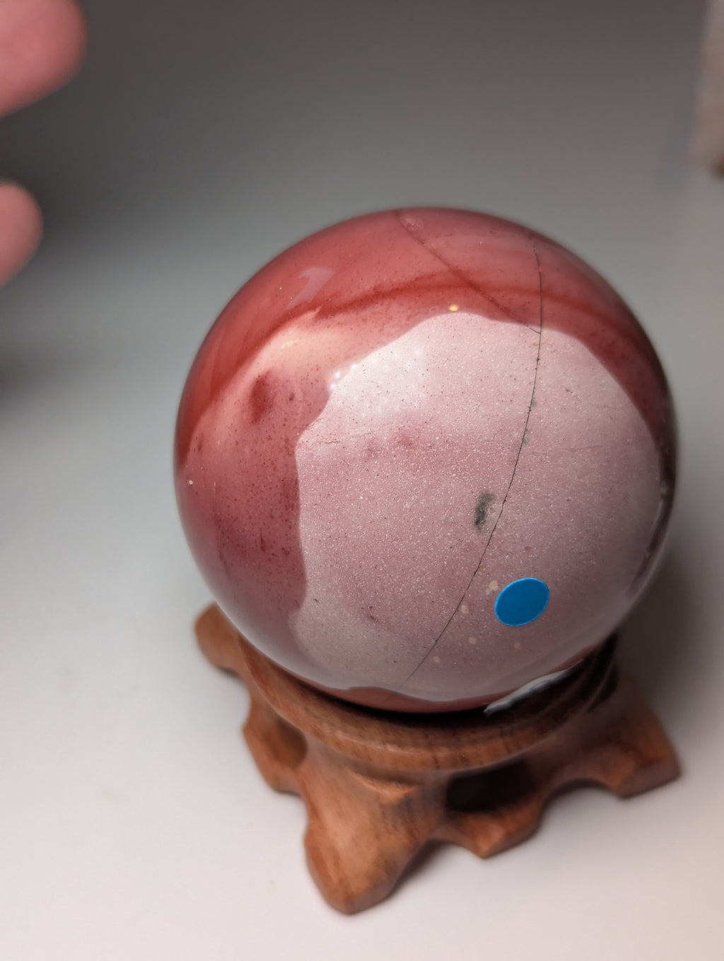 Mookite crystal sphere with stand