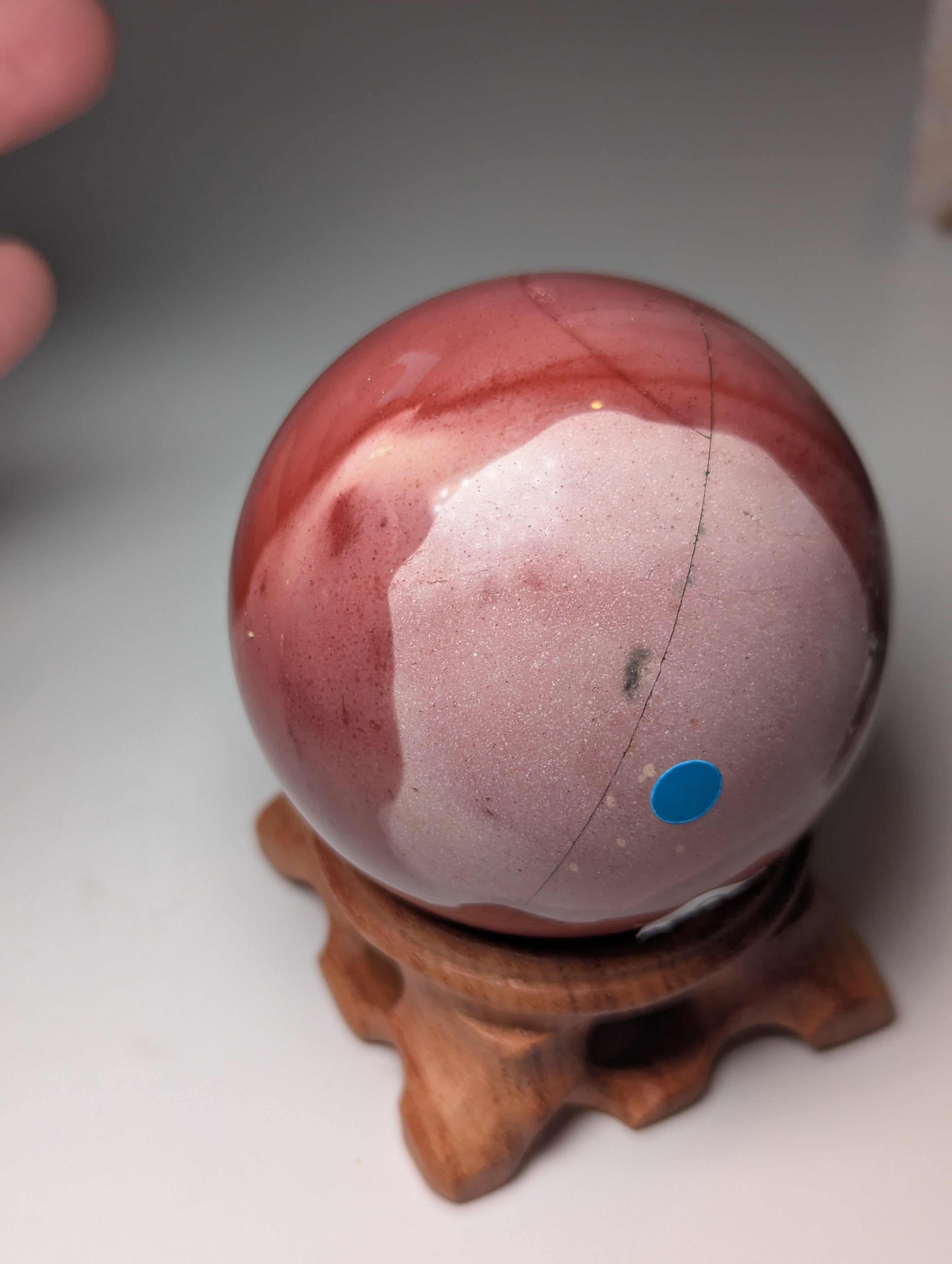 Mookite crystal sphere with stand