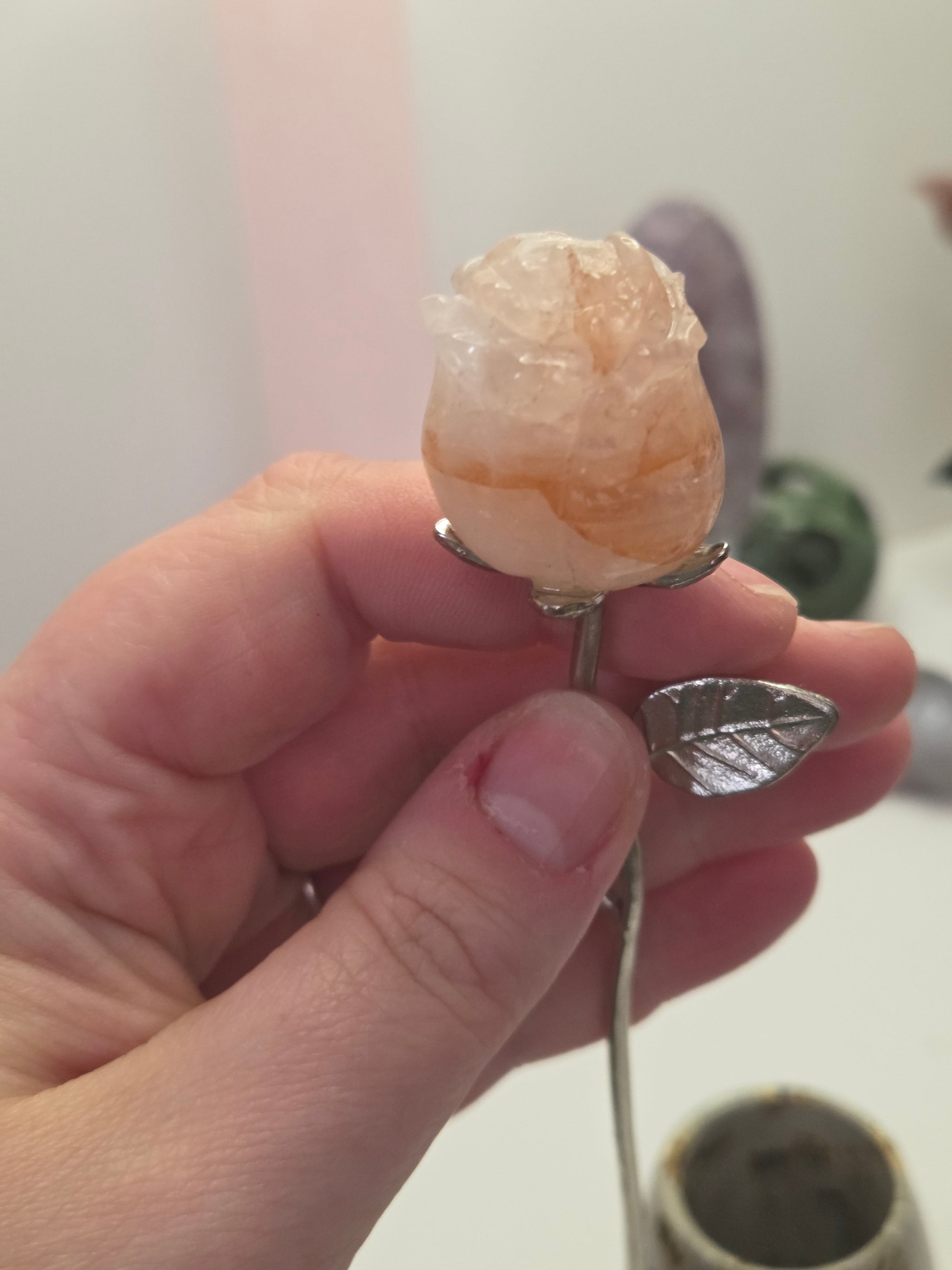 Fire quartz crystal rose carving on a stem